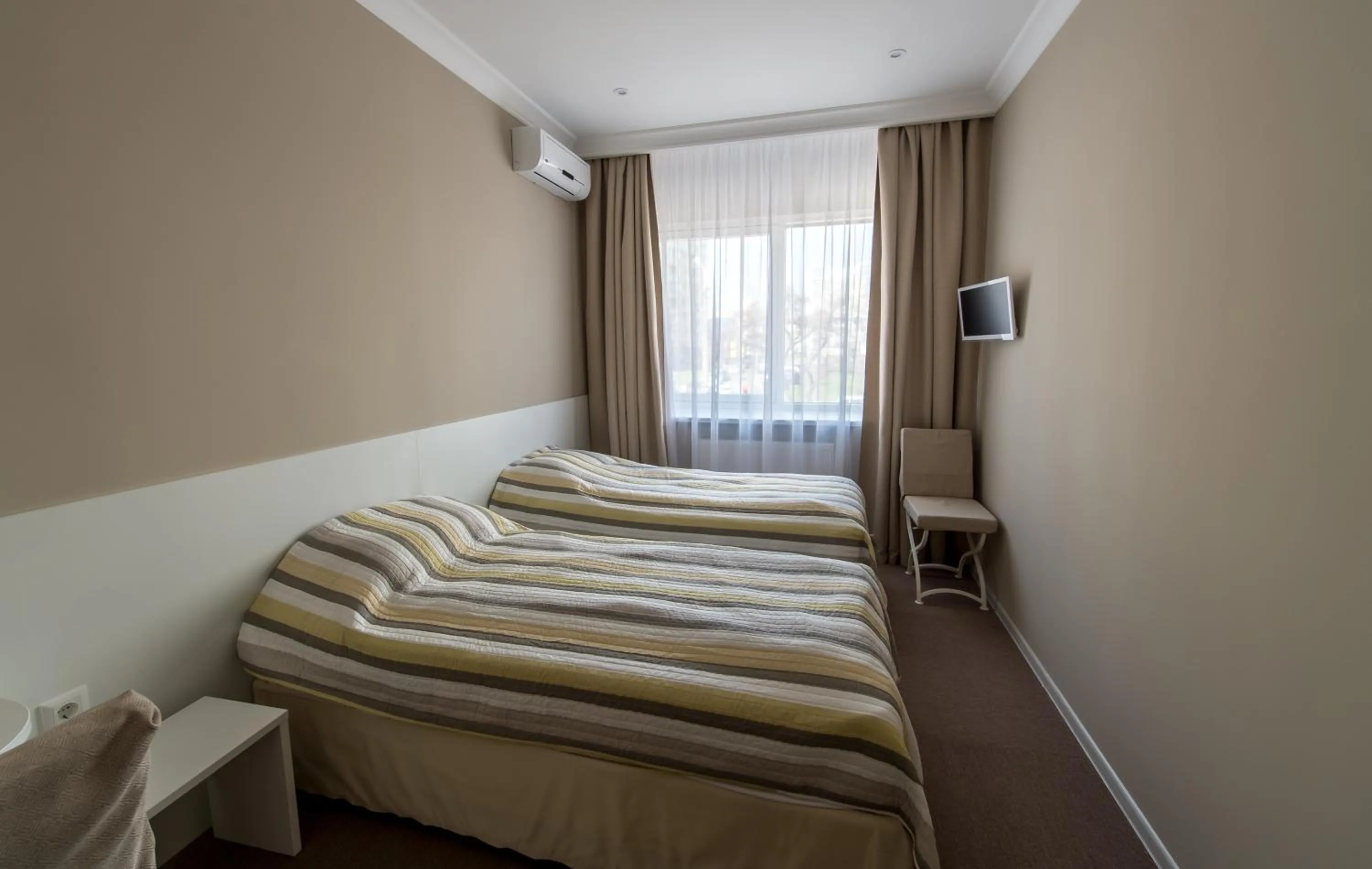 Photo of the whole room, Bed in light hotel & hub