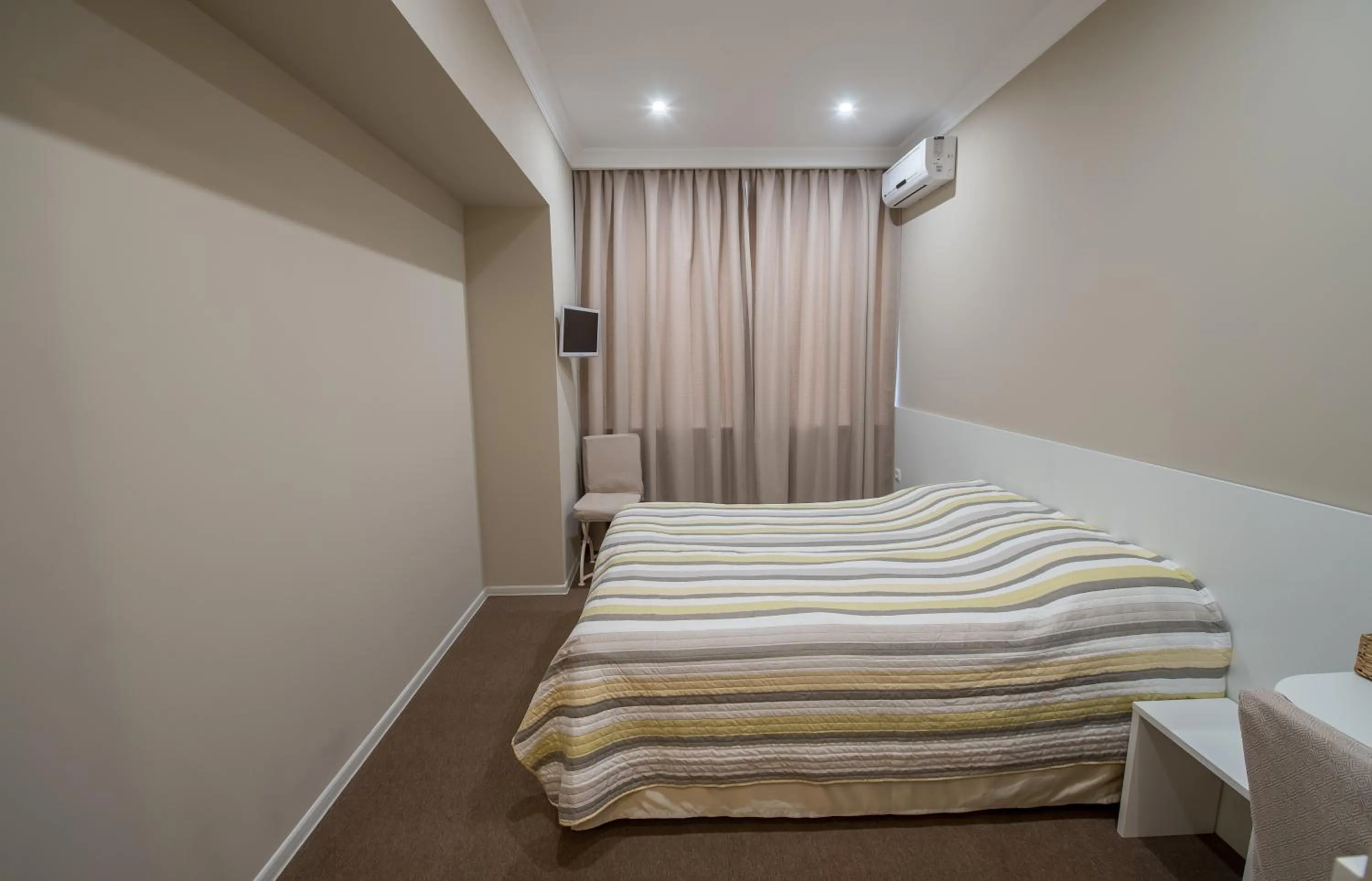 Photo of the whole room, Bed in light hotel & hub