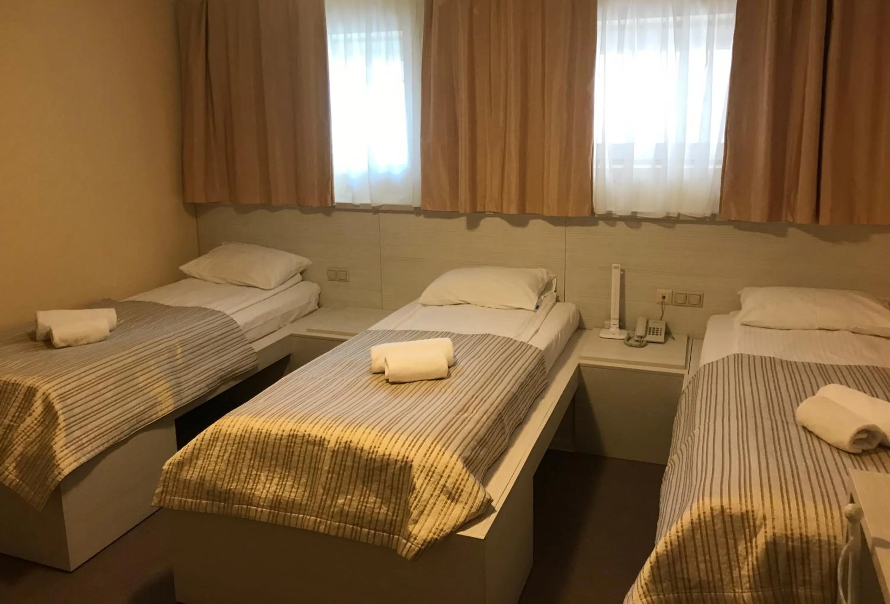Photo of the whole room, Bed in light hotel & hub