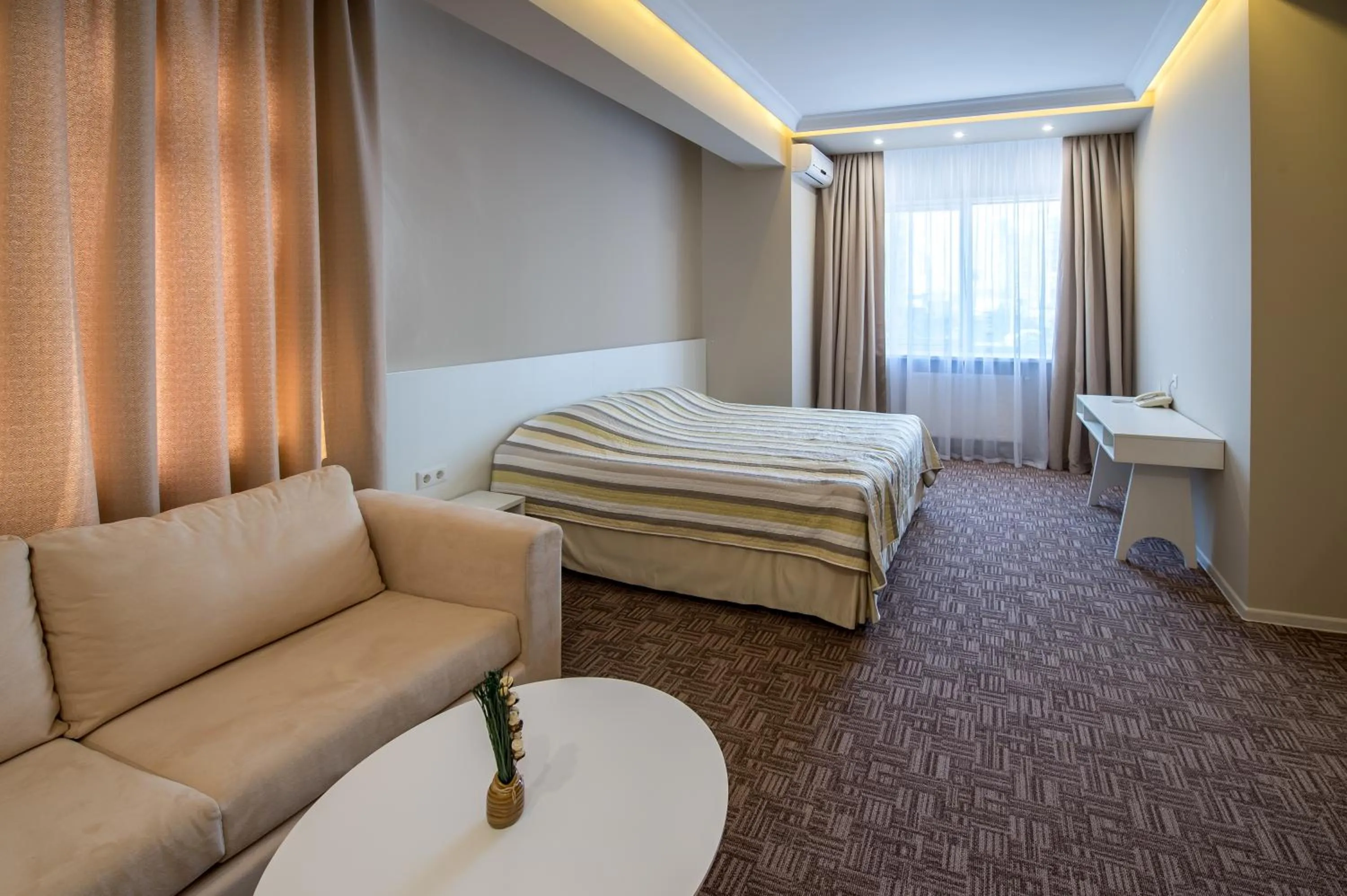 Photo of the whole room, Bed in light hotel & hub