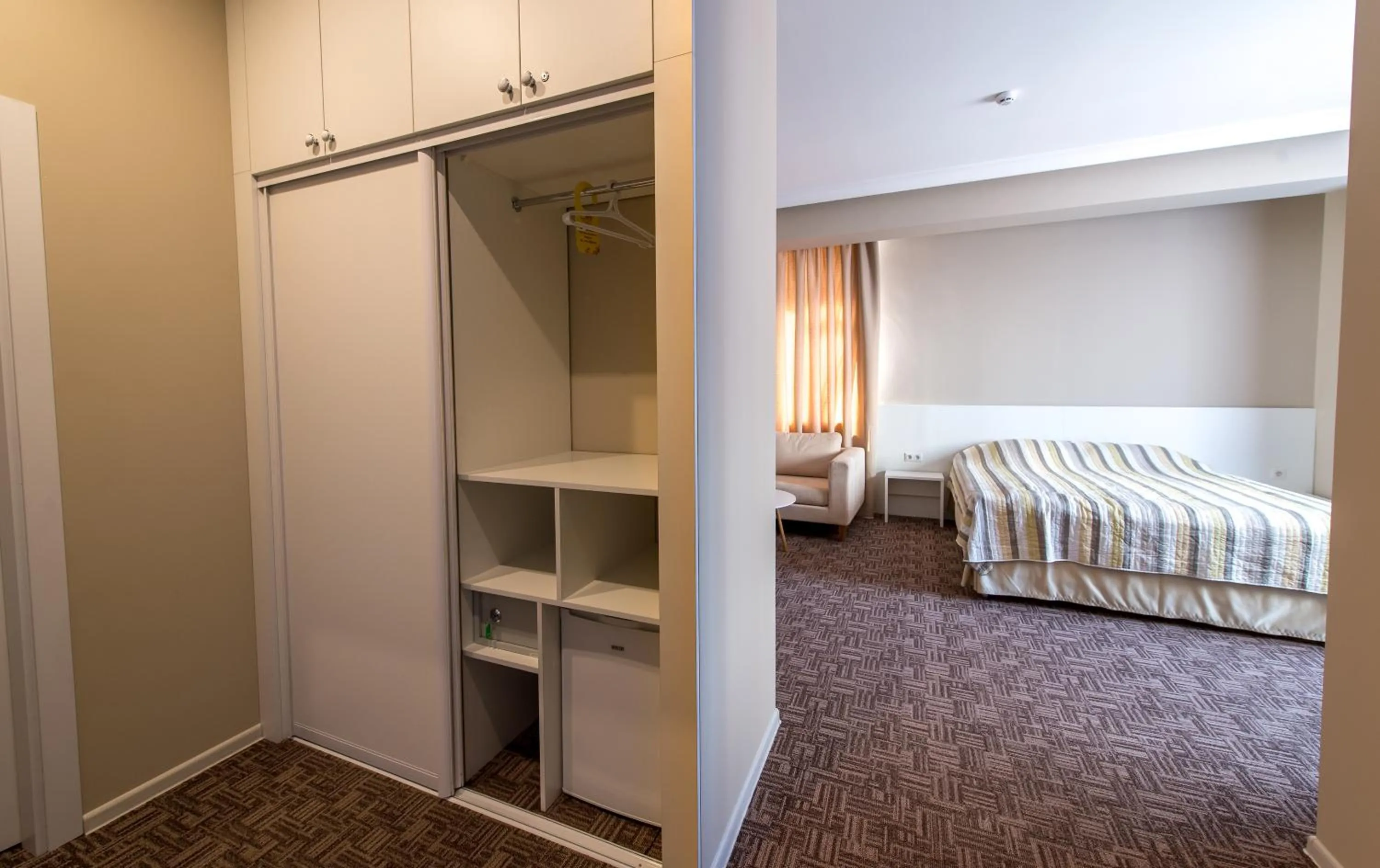 Photo of the whole room, Bed in light hotel & hub
