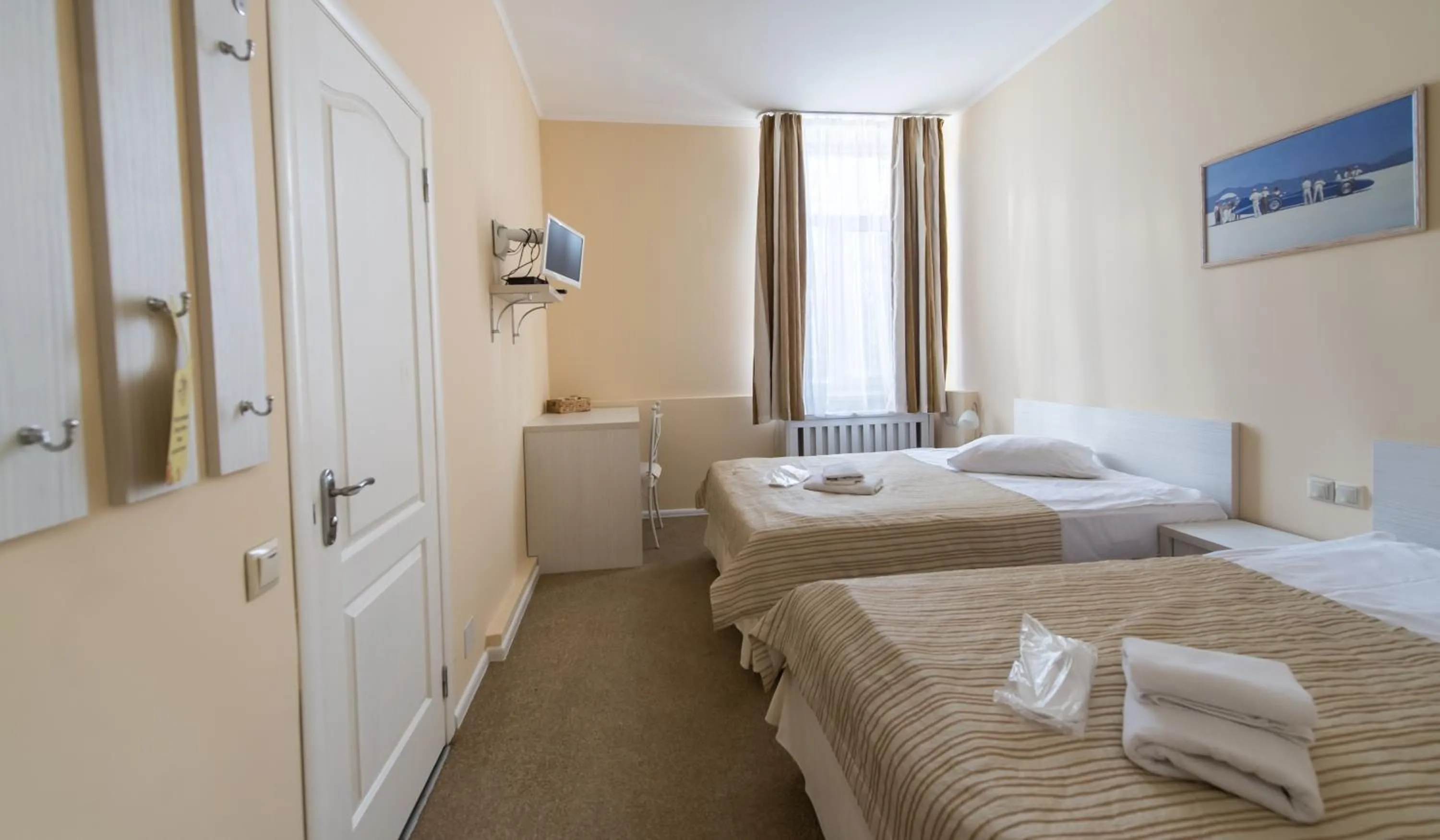 Photo of the whole room, Bed in light hotel & hub