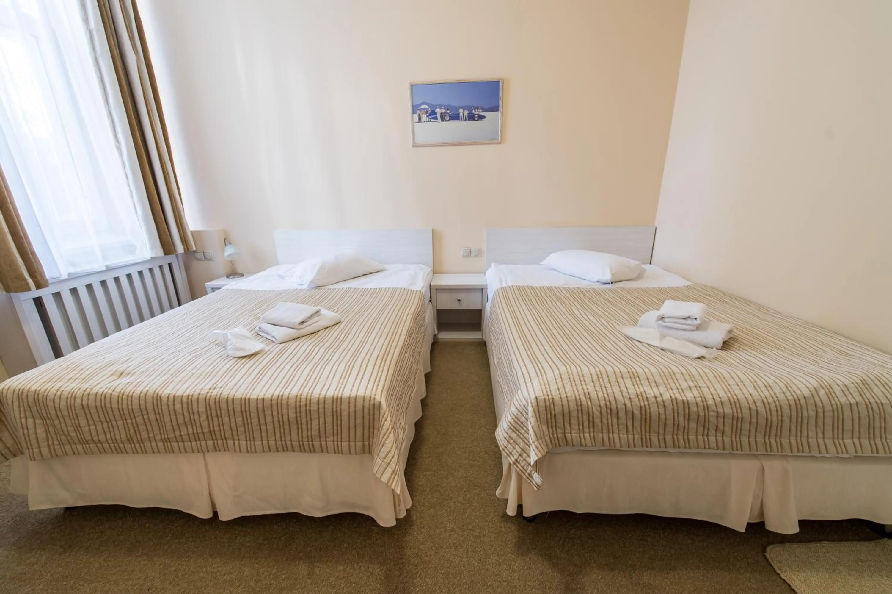 Photo of the whole room, Bed in light hotel & hub