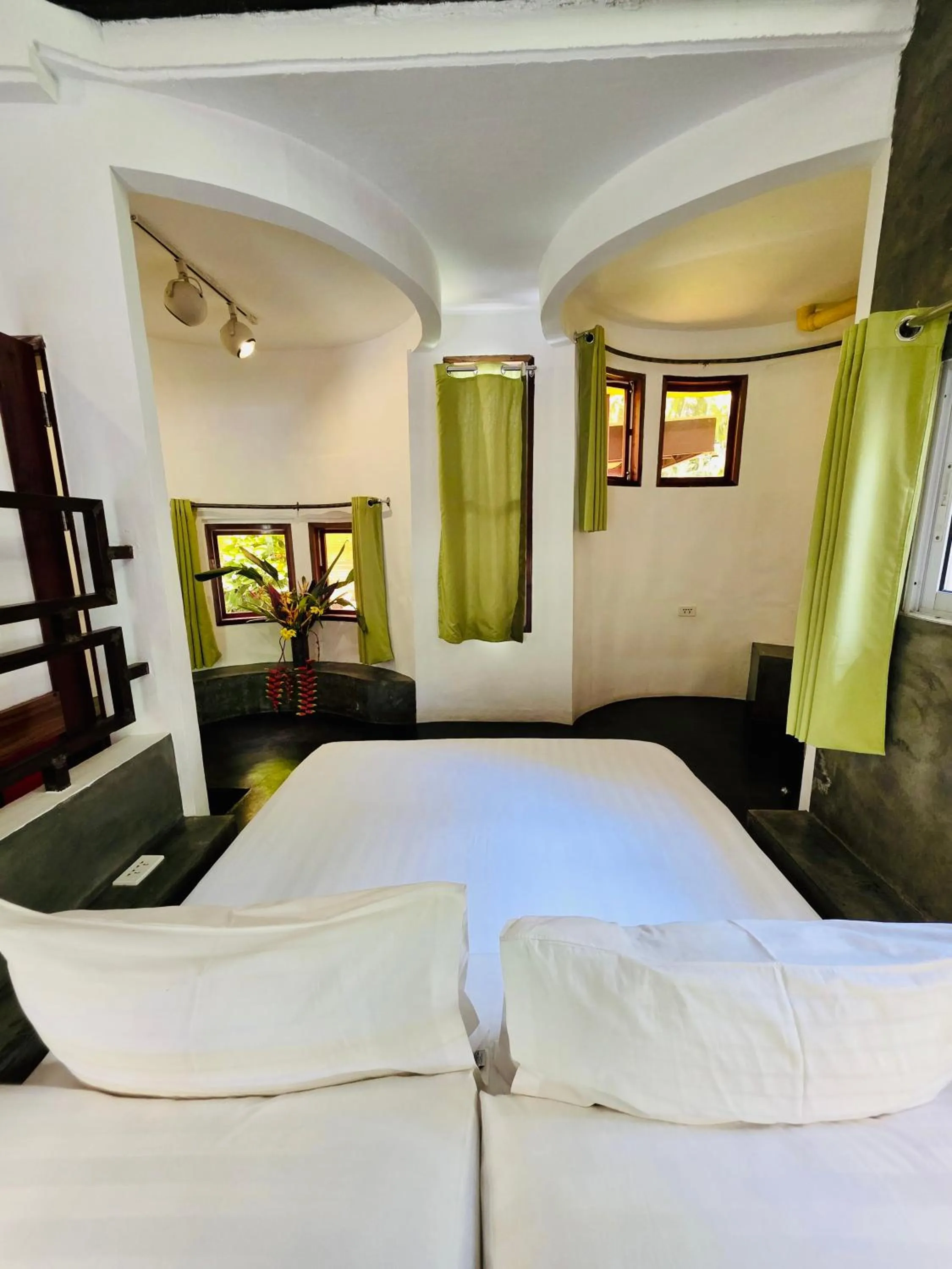 Bed in SomeWhere Else Boutique Resort