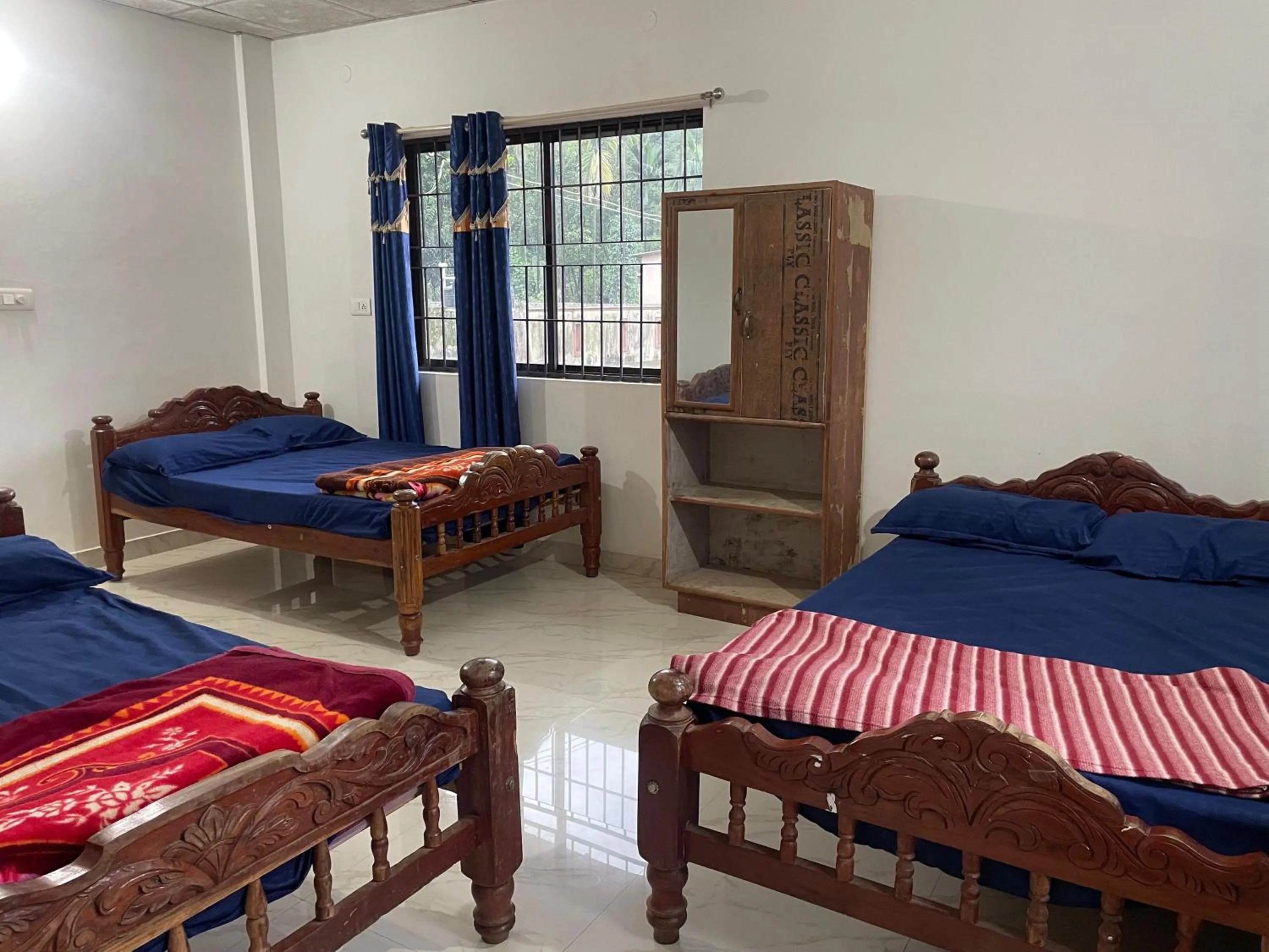 Bed in Nisarga Homestay
