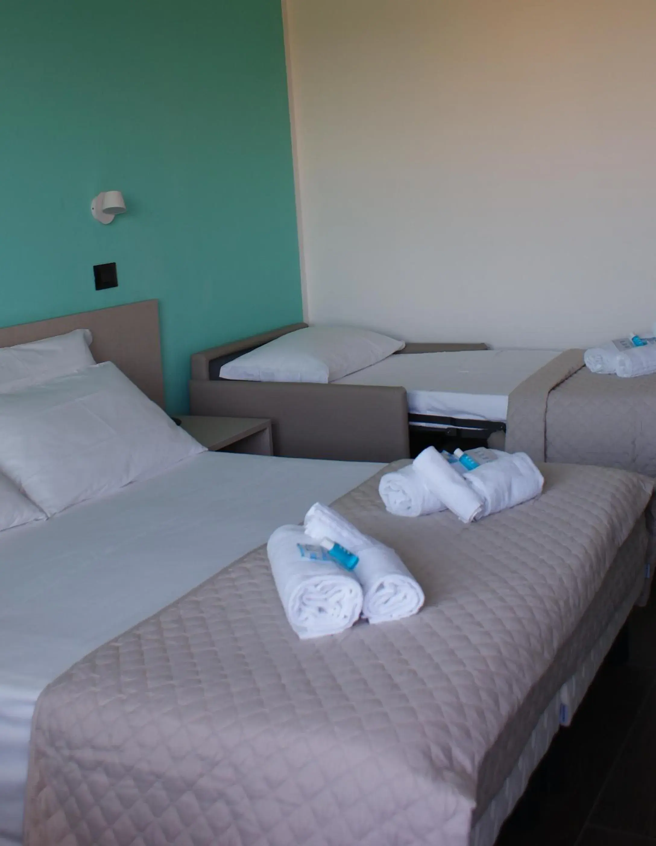 Triple Room with Side Sea View in Hotel Palazzo Caveja Triple Room with Side Sea View in Hotel Palazzo Caveja