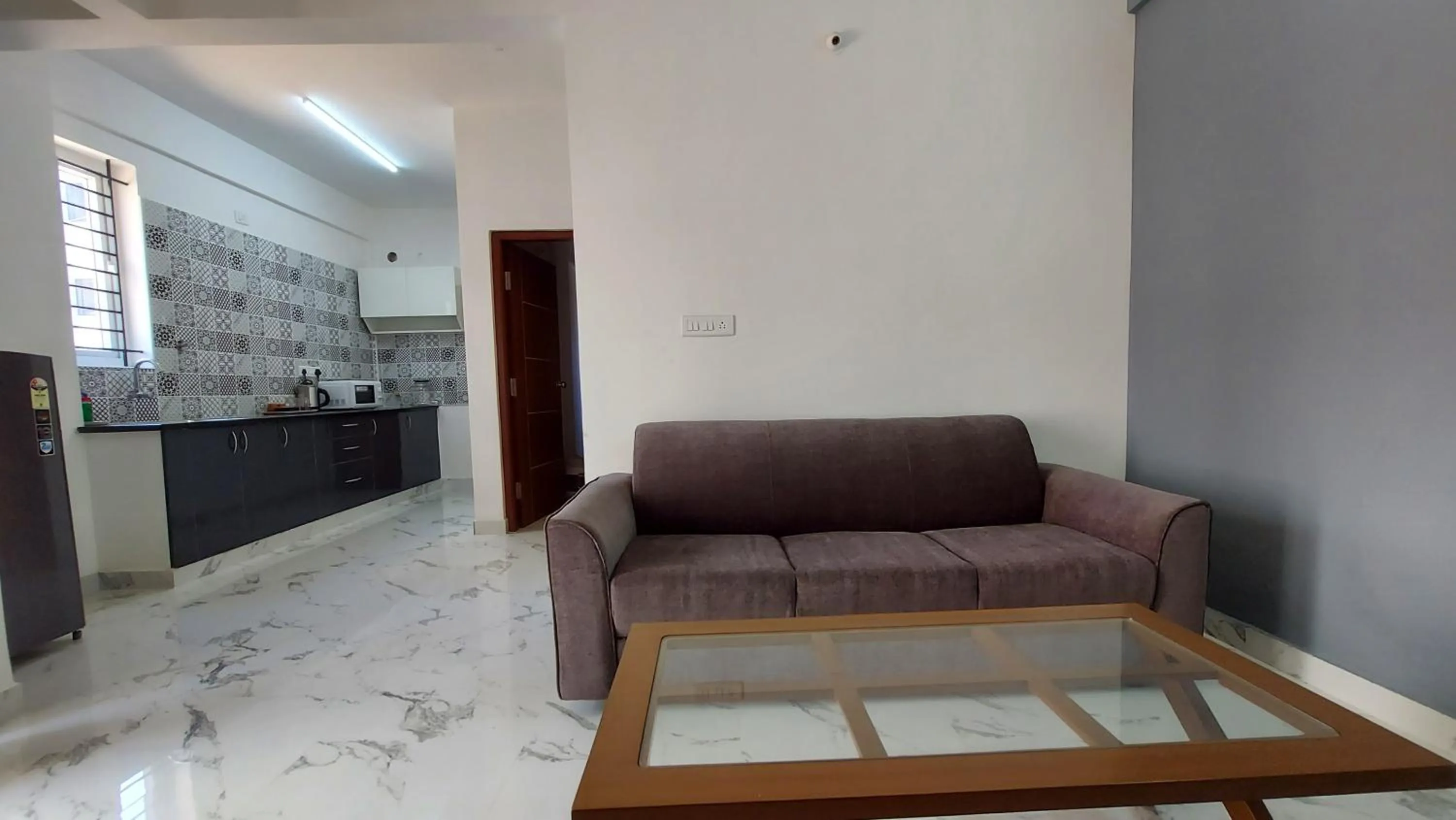 Kitchen or kitchenette in Tranquil Serviced Apartments - HSR Layout