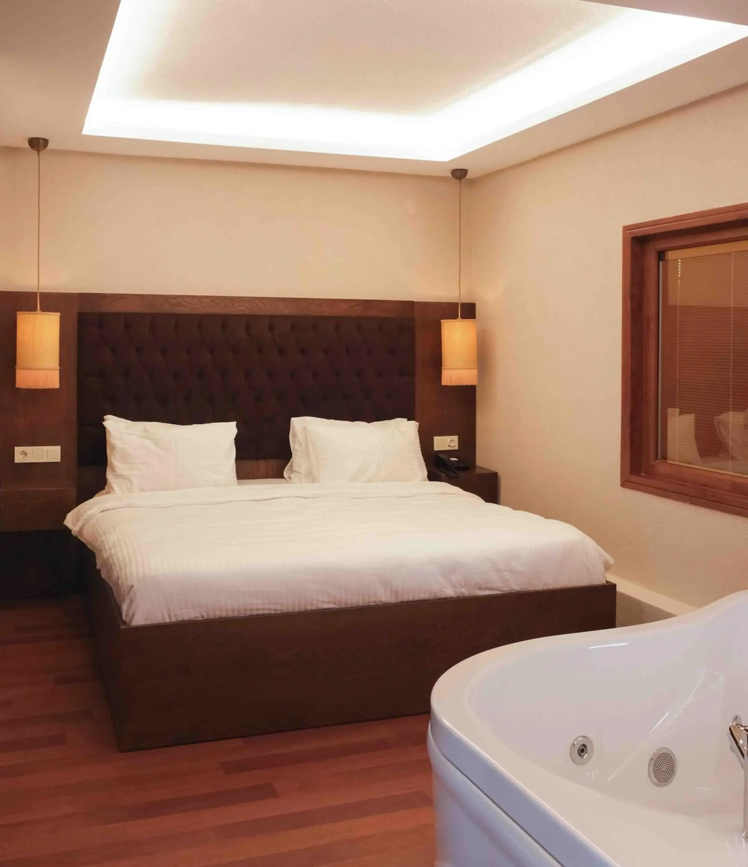 Bed in Phellos Suites Boutique Hotel Bed in Phellos Suites Boutique Hotel