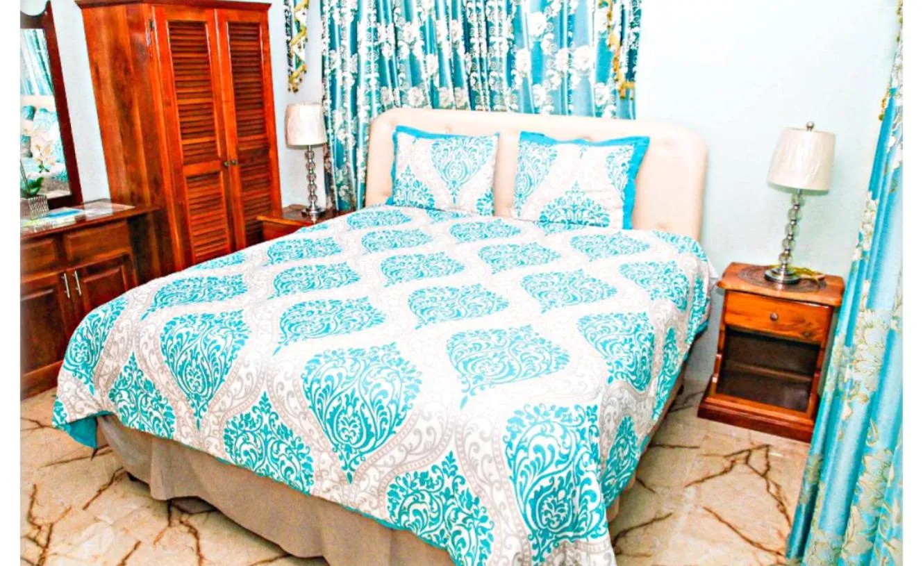 Bed in Dela de-Rose Guest House Negril Jamaica