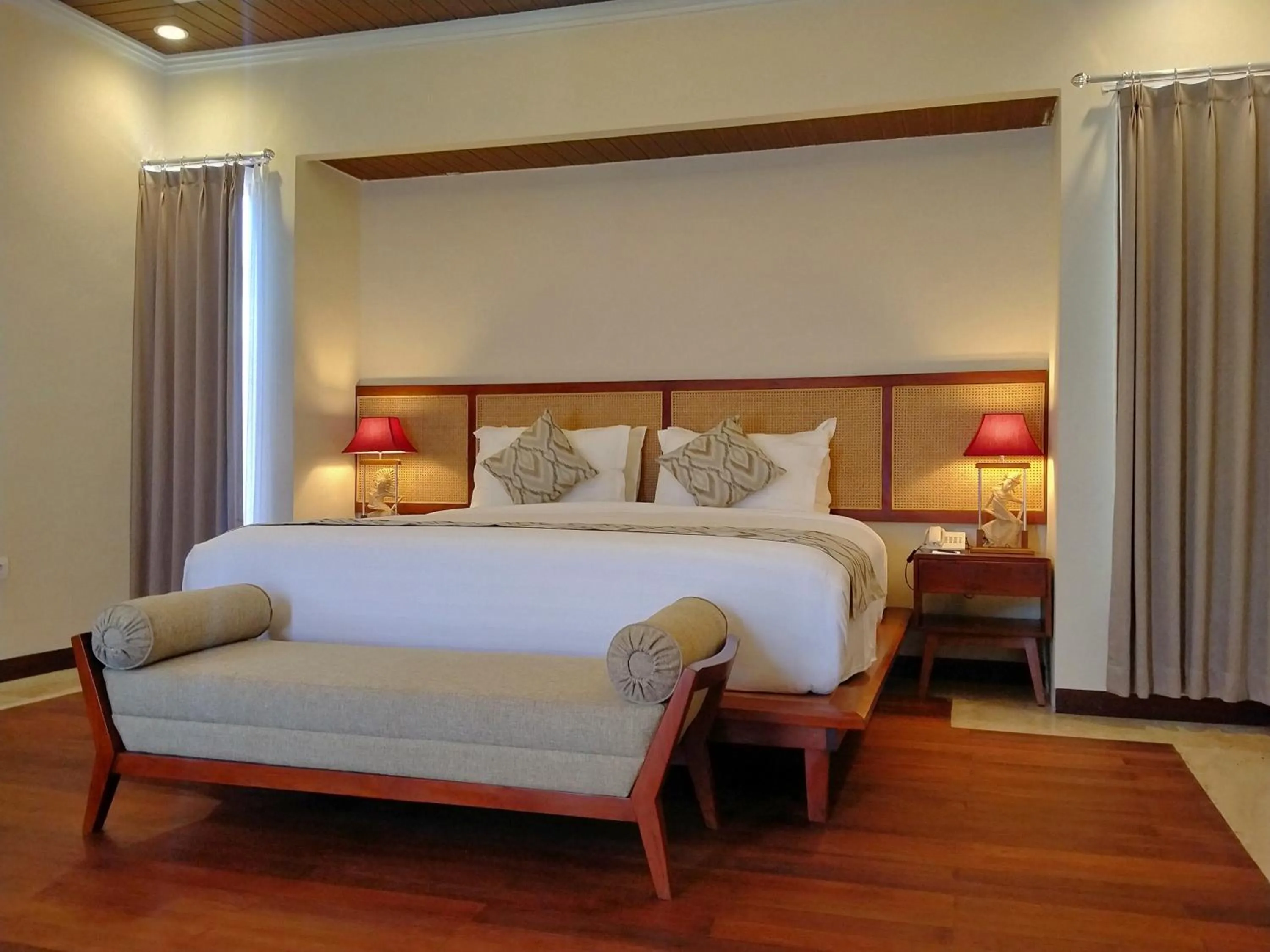 Bed in The Grand Villandra Resort Lovina