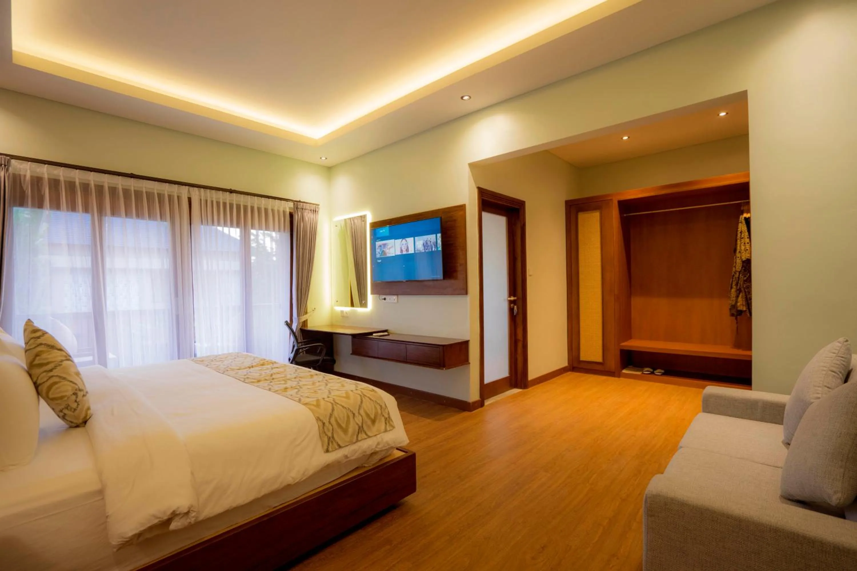 Bed in The Grand Villandra Resort Lovina