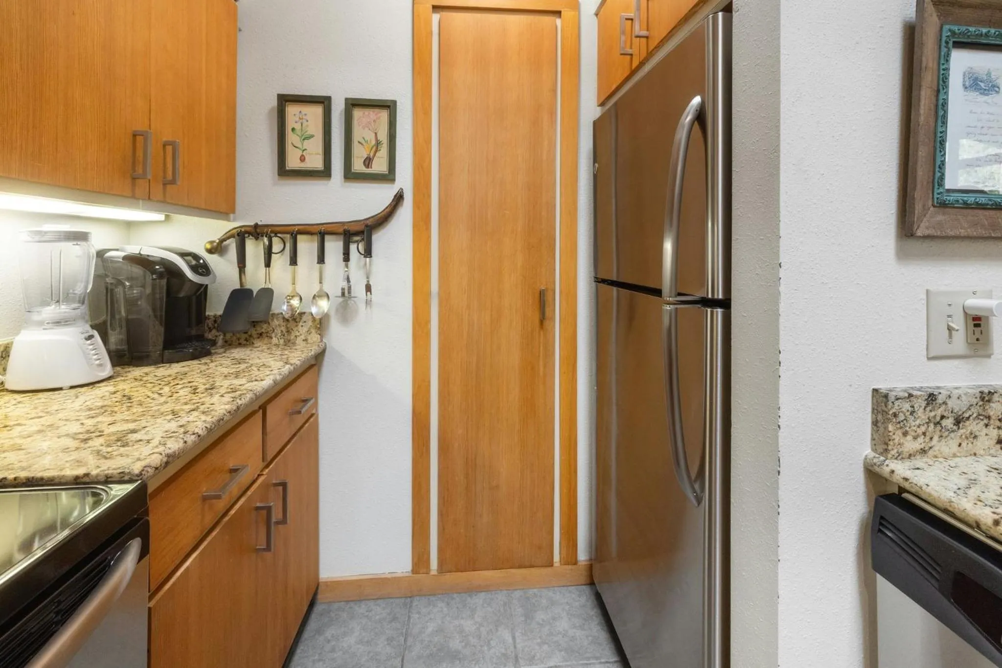 Communal kitchen in Evergreen Condominiums by Vail Resorts