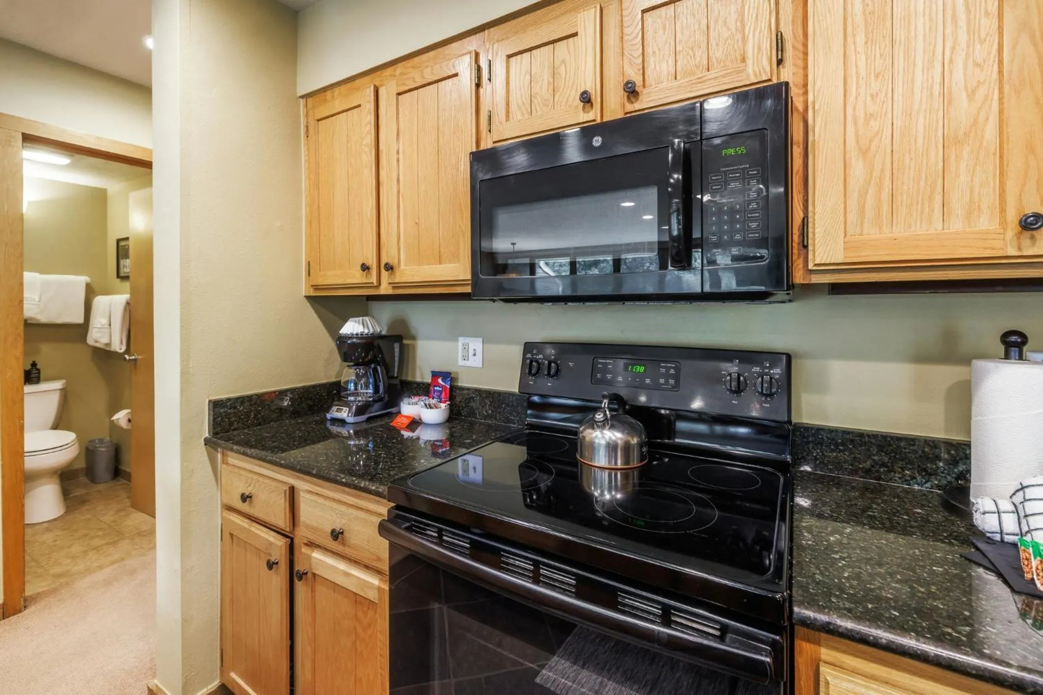 Communal kitchen in Evergreen Condominiums by Vail Resorts
