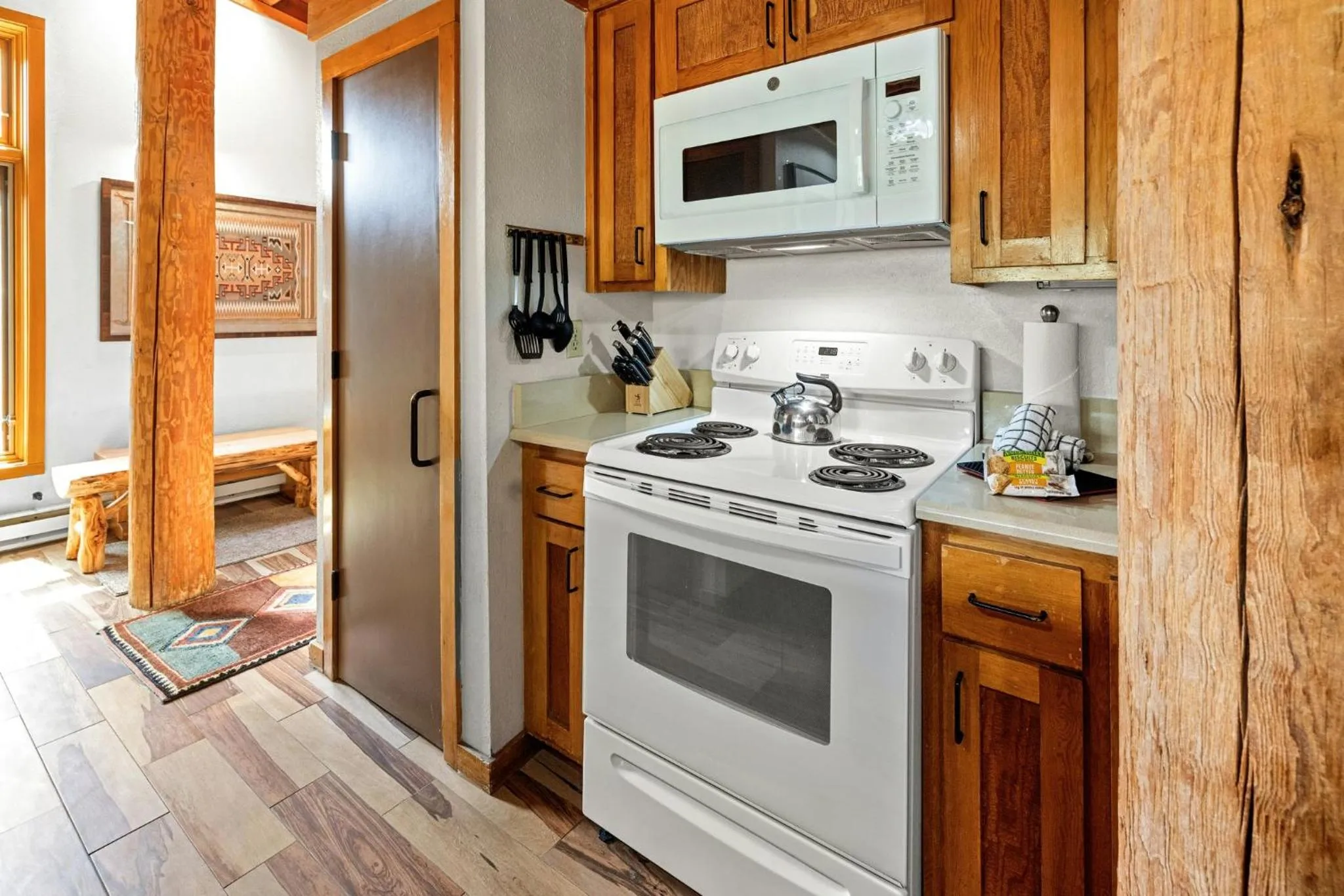 Communal kitchen in Evergreen Condominiums by Vail Resorts