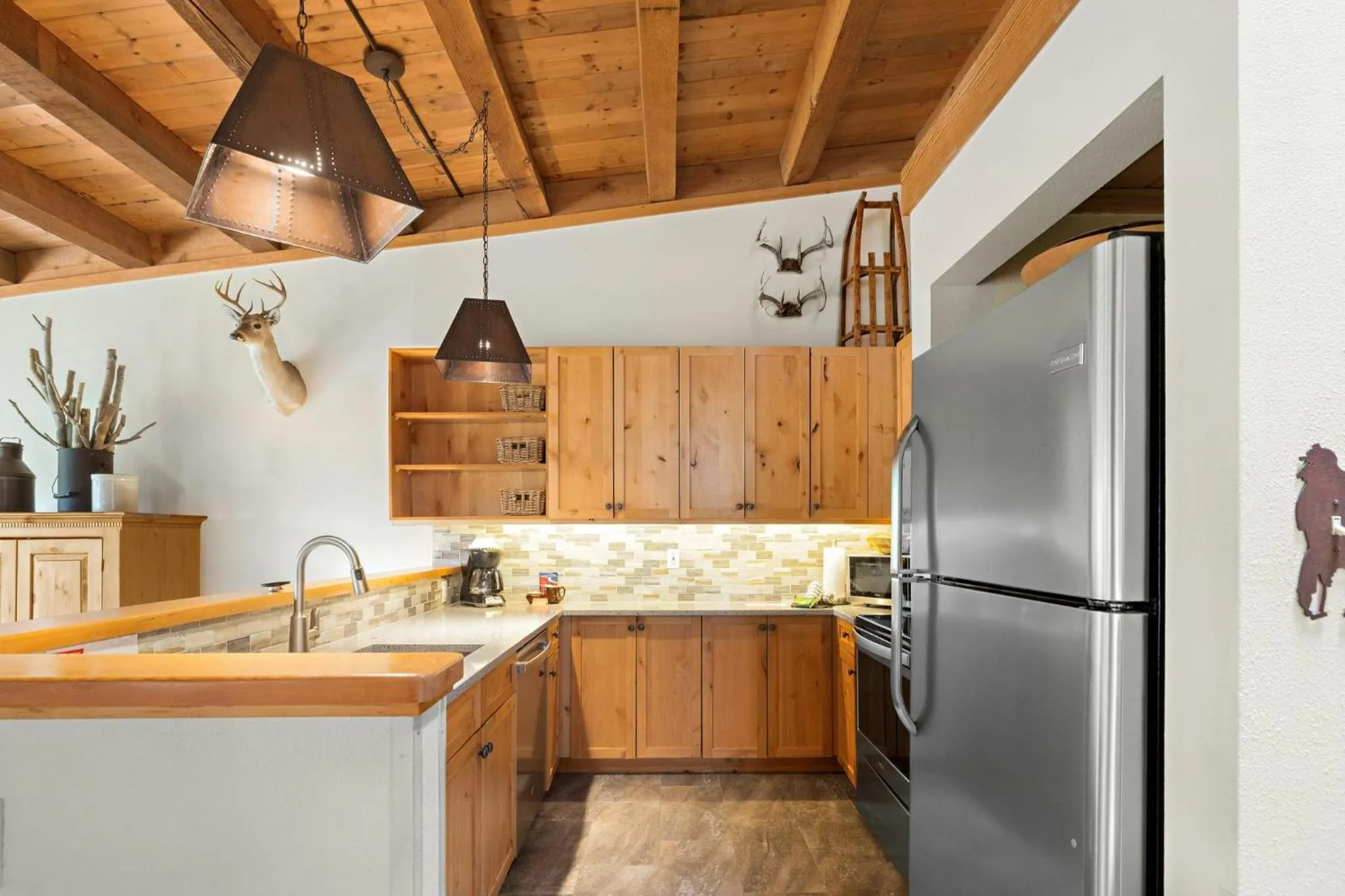 Communal kitchen in Evergreen Condominiums by Vail Resorts