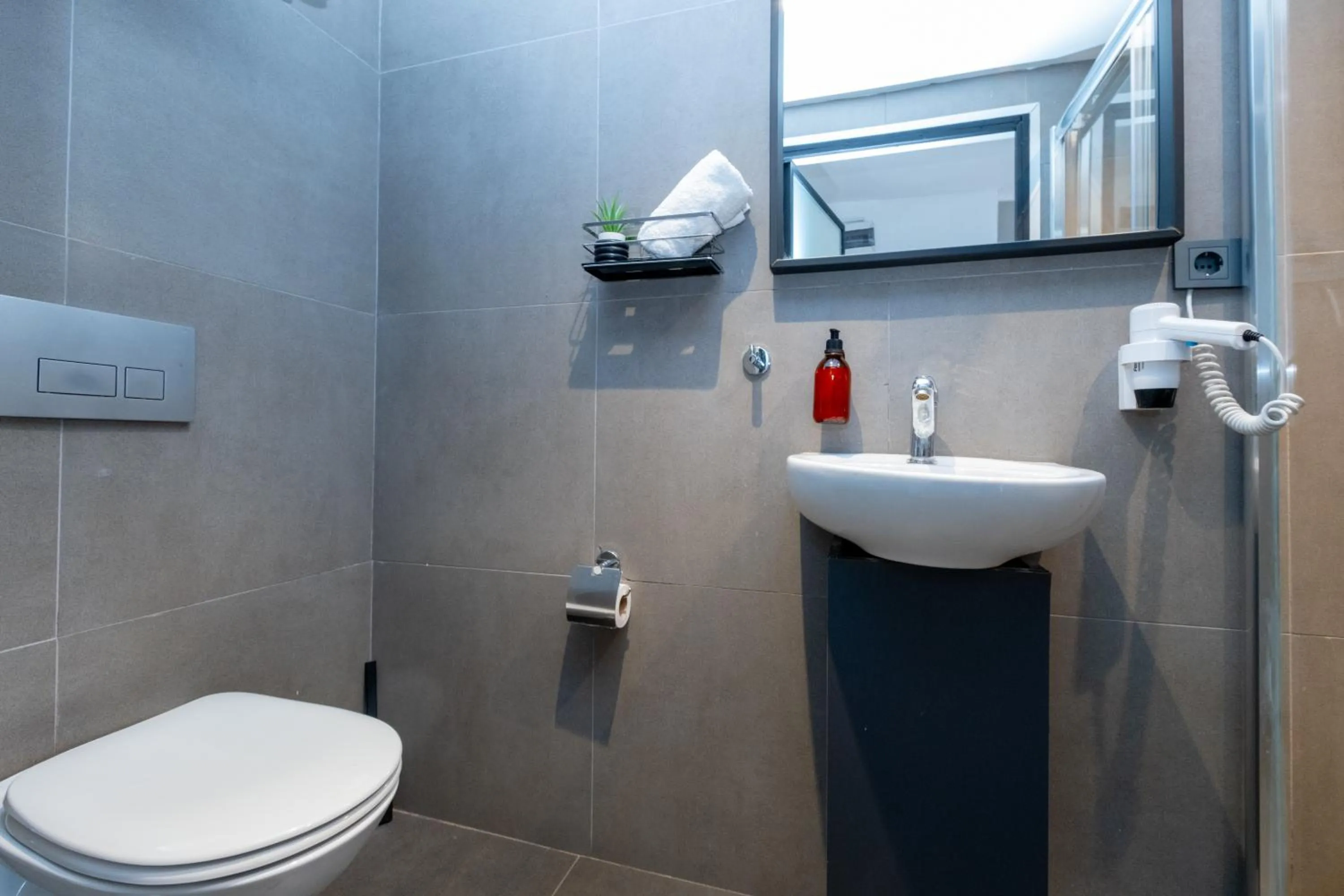 Toilet in Pesa Suites