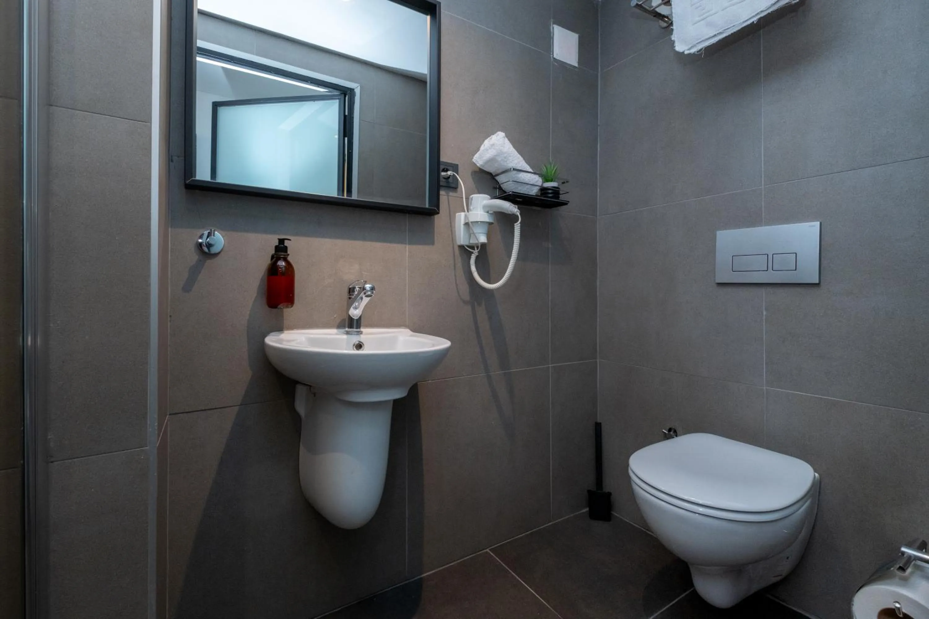 Toilet in Pesa Suites