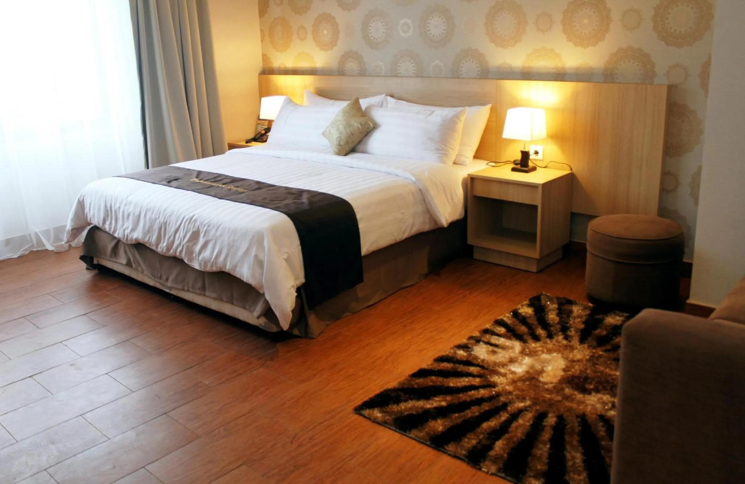 Bed in Padjadjaran Suites Resort and Convention Hotel