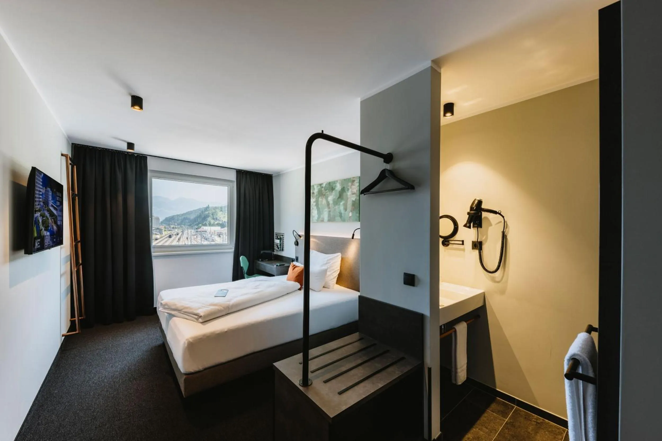 Photo of the whole room, Bed in NIGHT INN Hotel Bahnhofcity Feldkirch