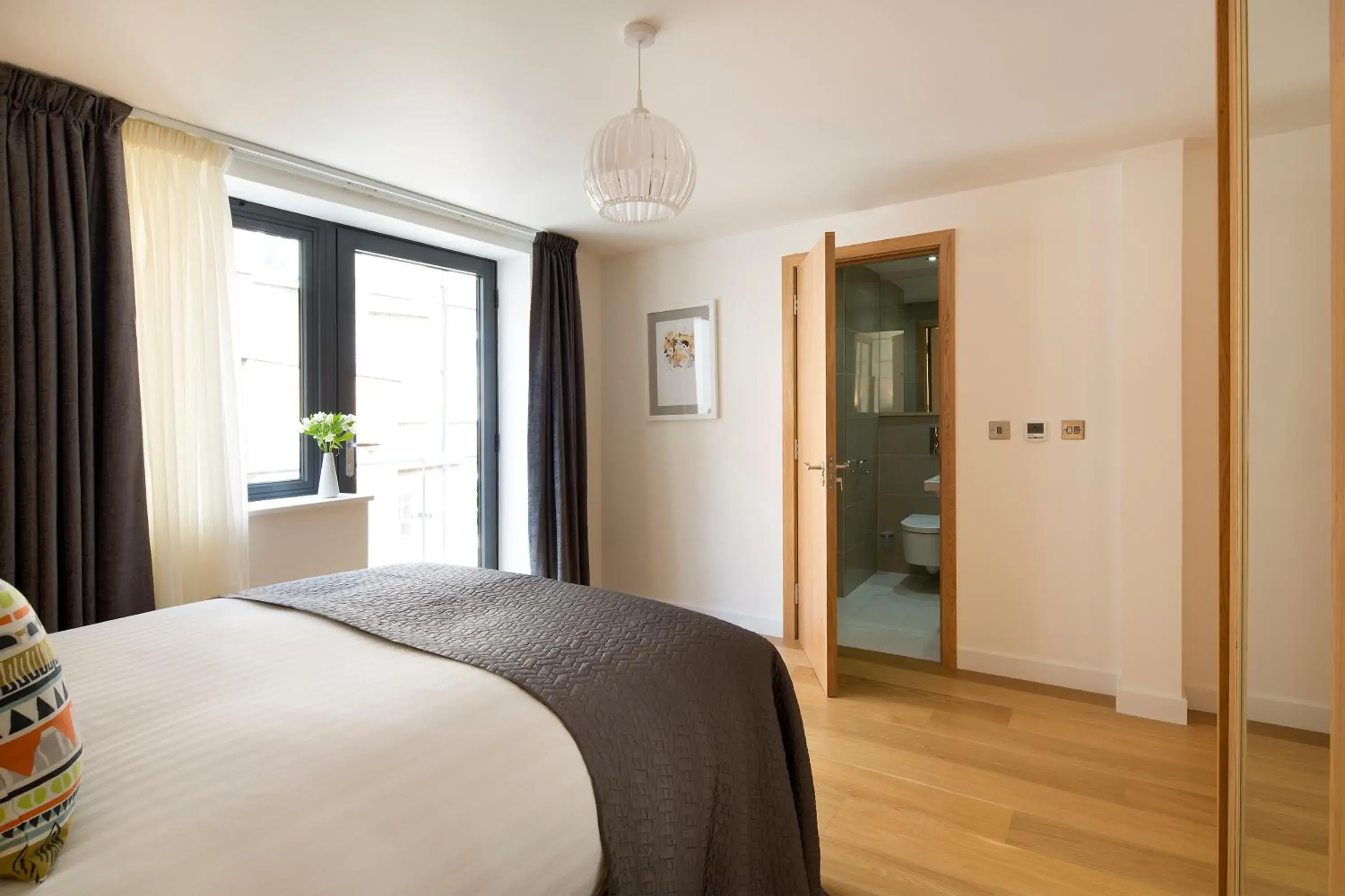 Bed in Cambric by Aeria Apartments Bed in Cambric by Aeria Apartments