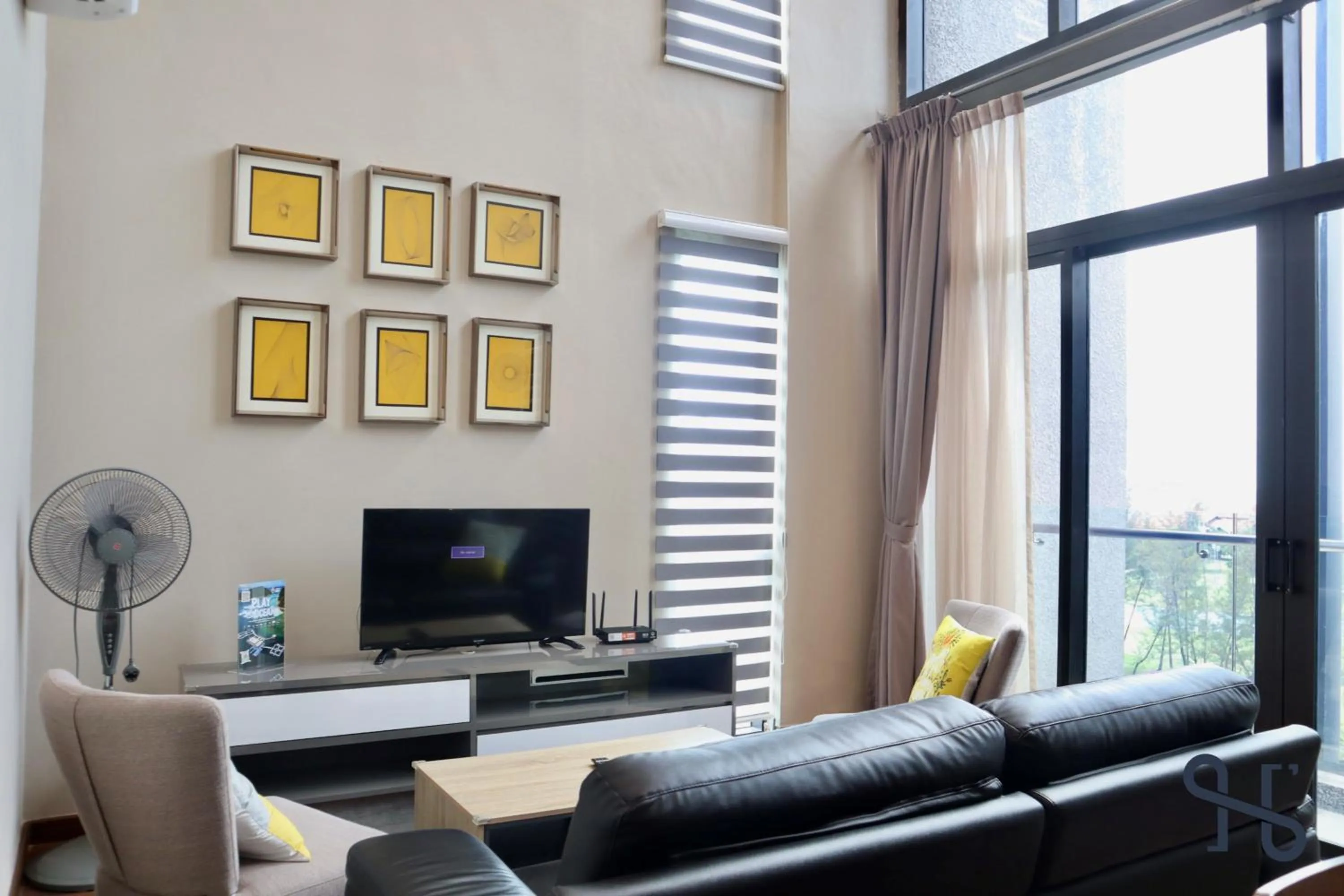 Communal lounge/ TV room in Homesuite' Home at Riverson Soho