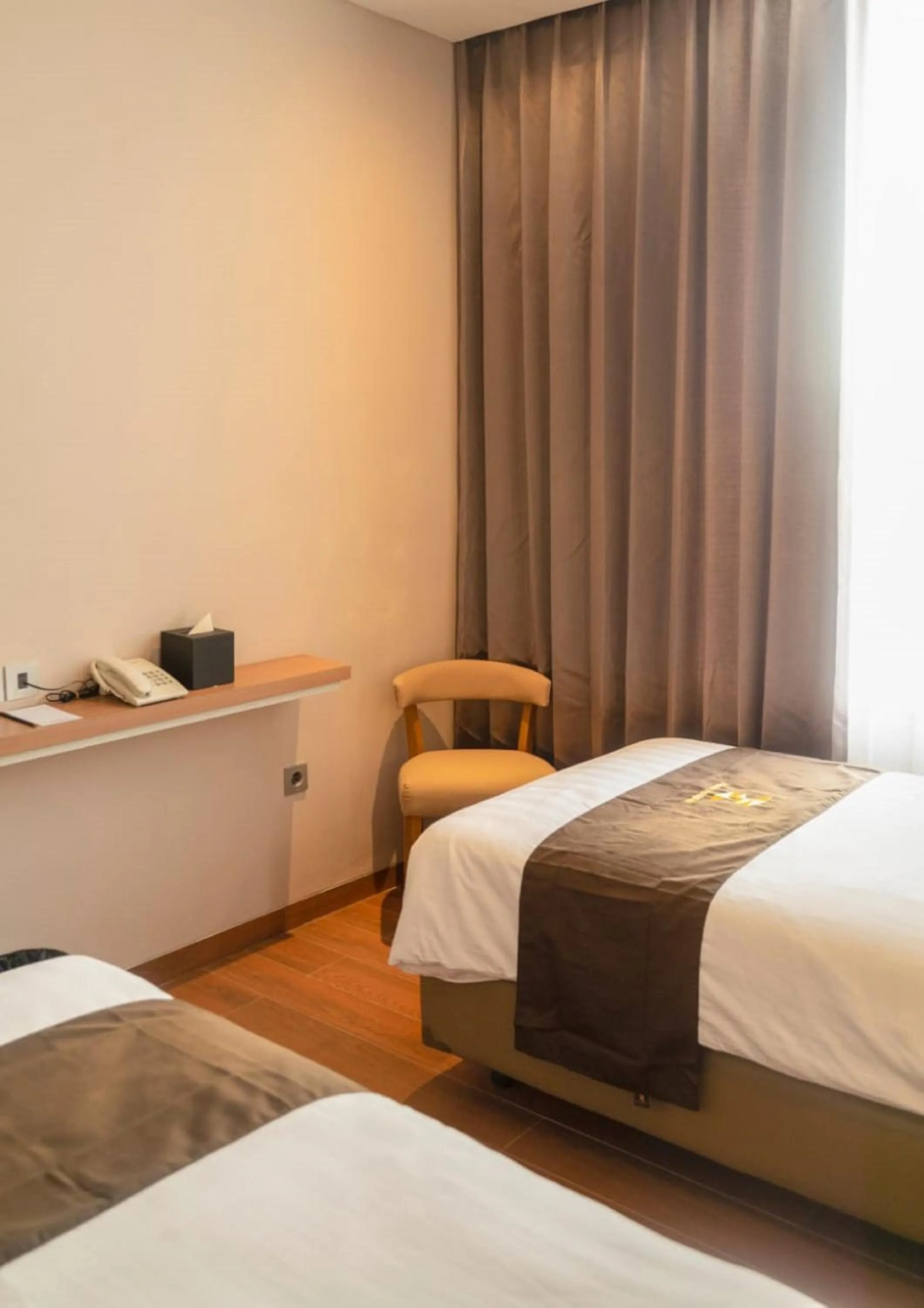 Bed in Zenith Premiere Hotel Baubau