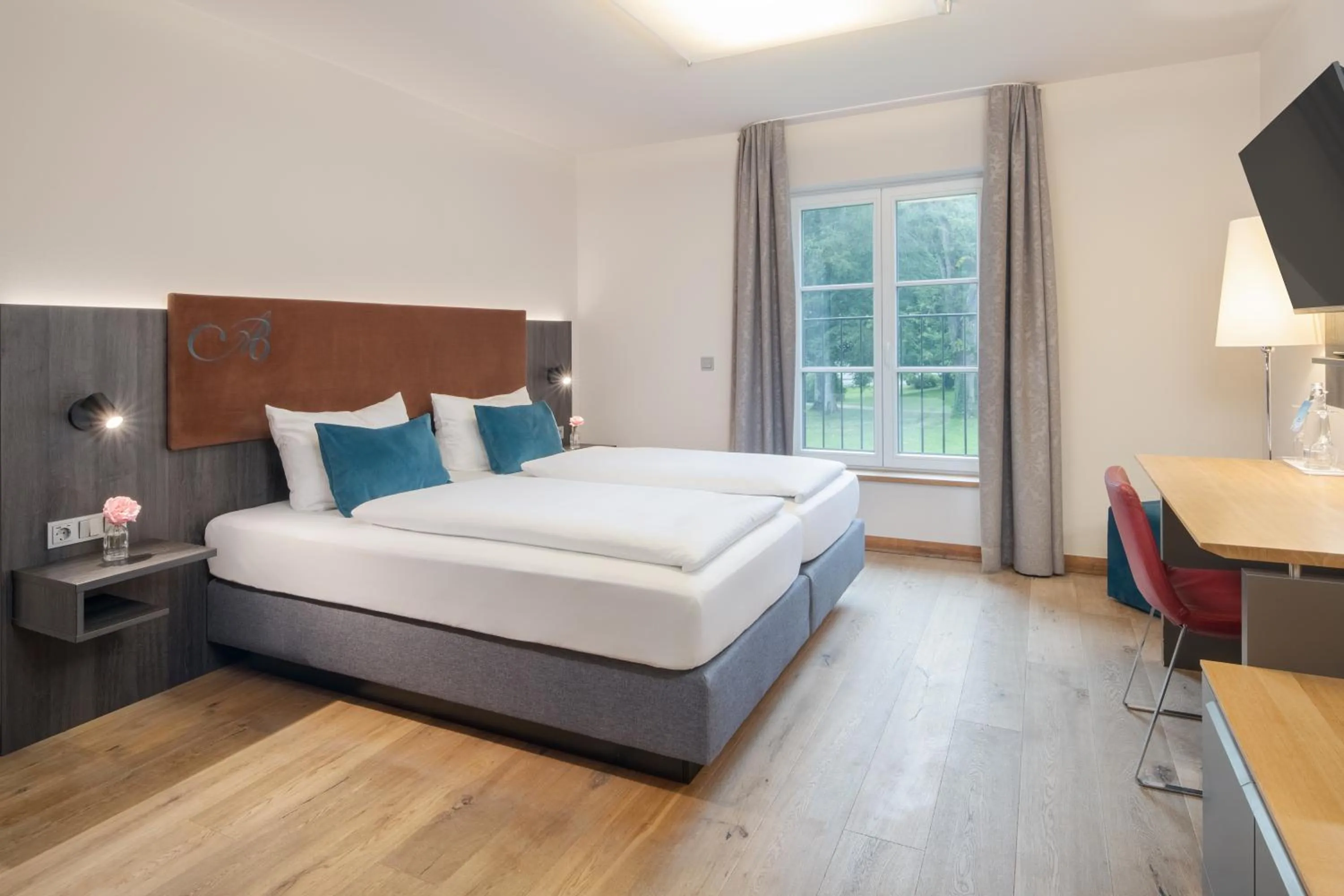 Photo of the whole room, Bed in Hotel Aiterbach am Chiemsee