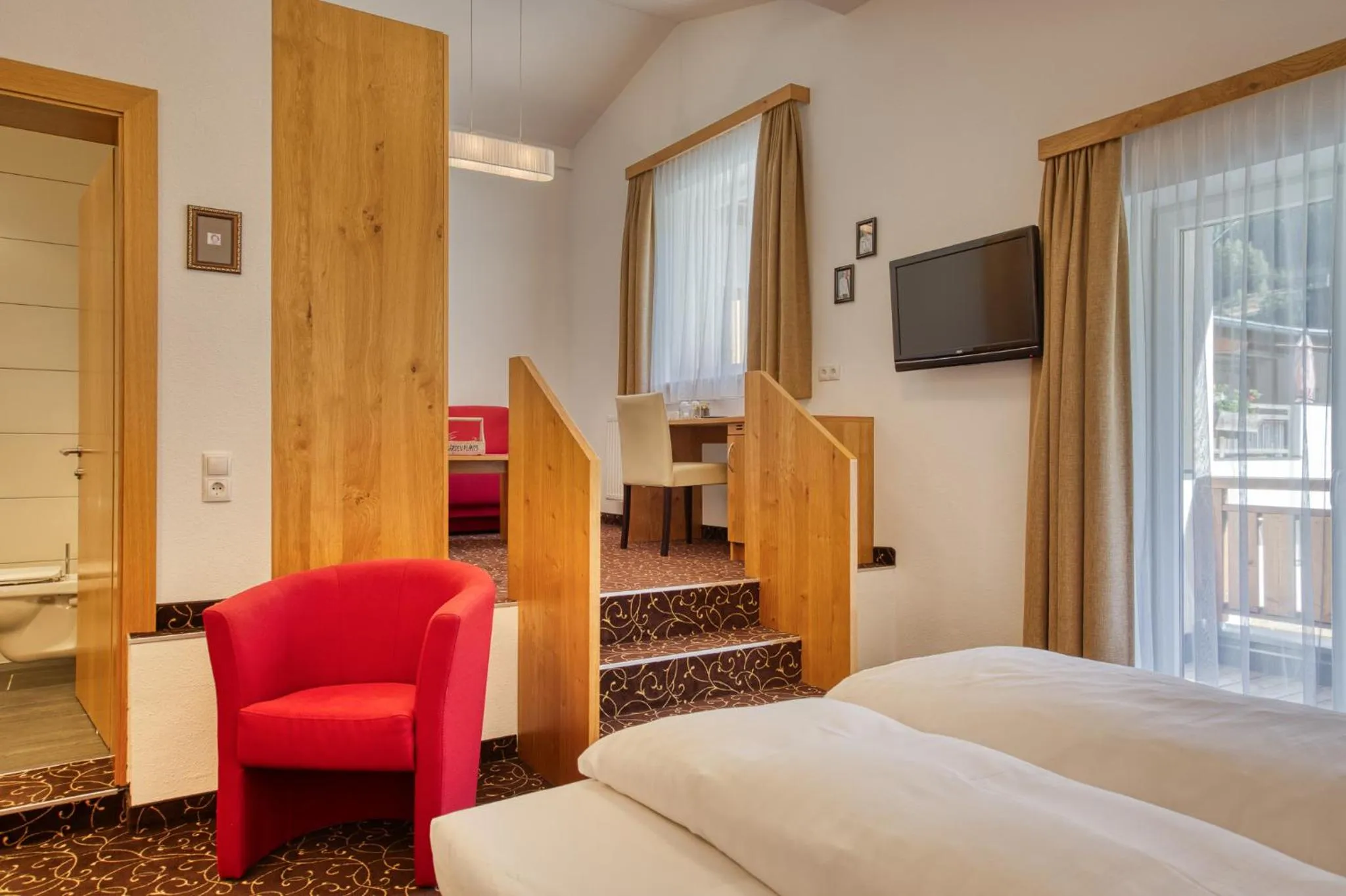 Seating area, Bed in Hotel Erika