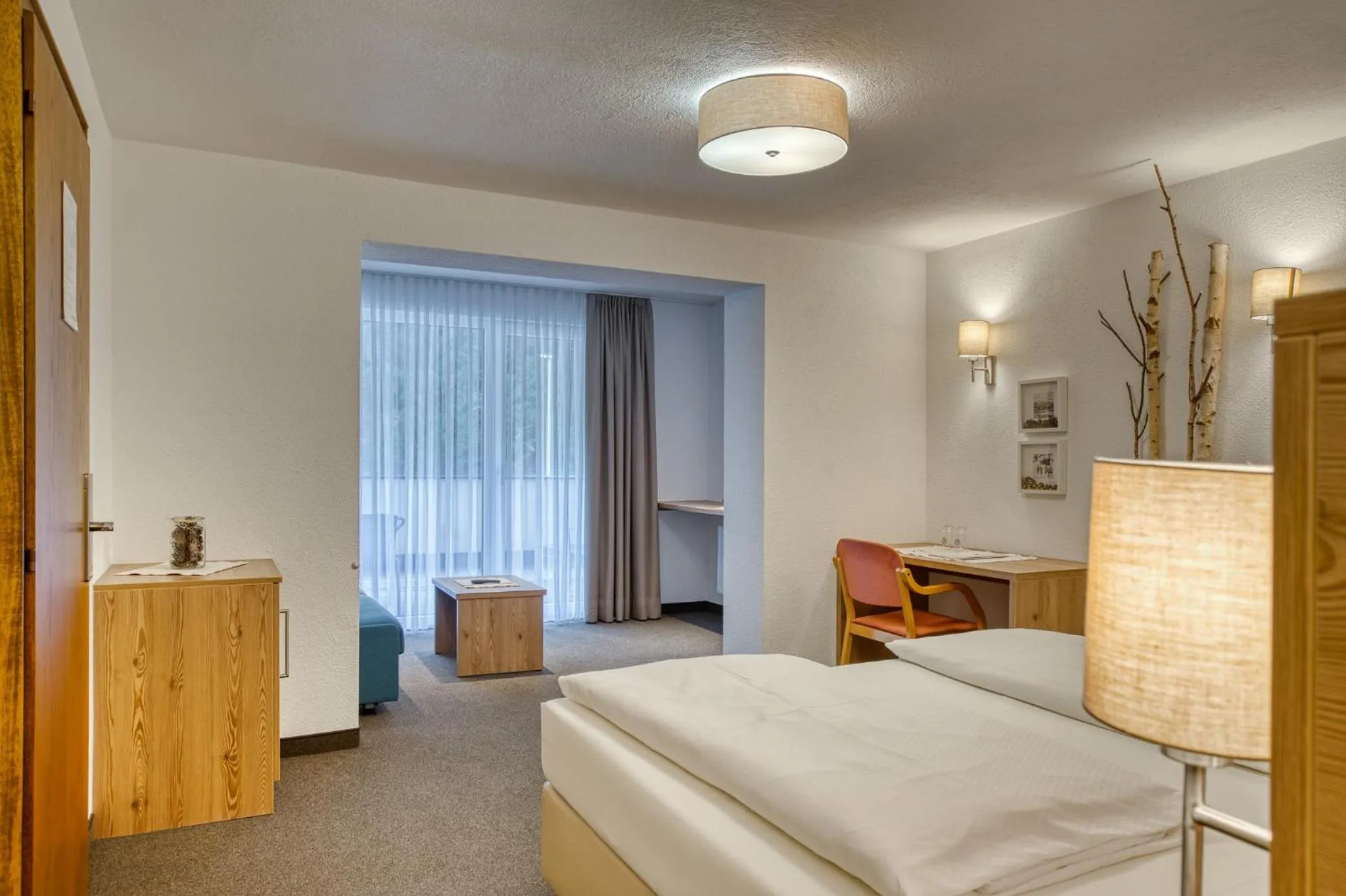 Living room, Bed in Hotel Erika