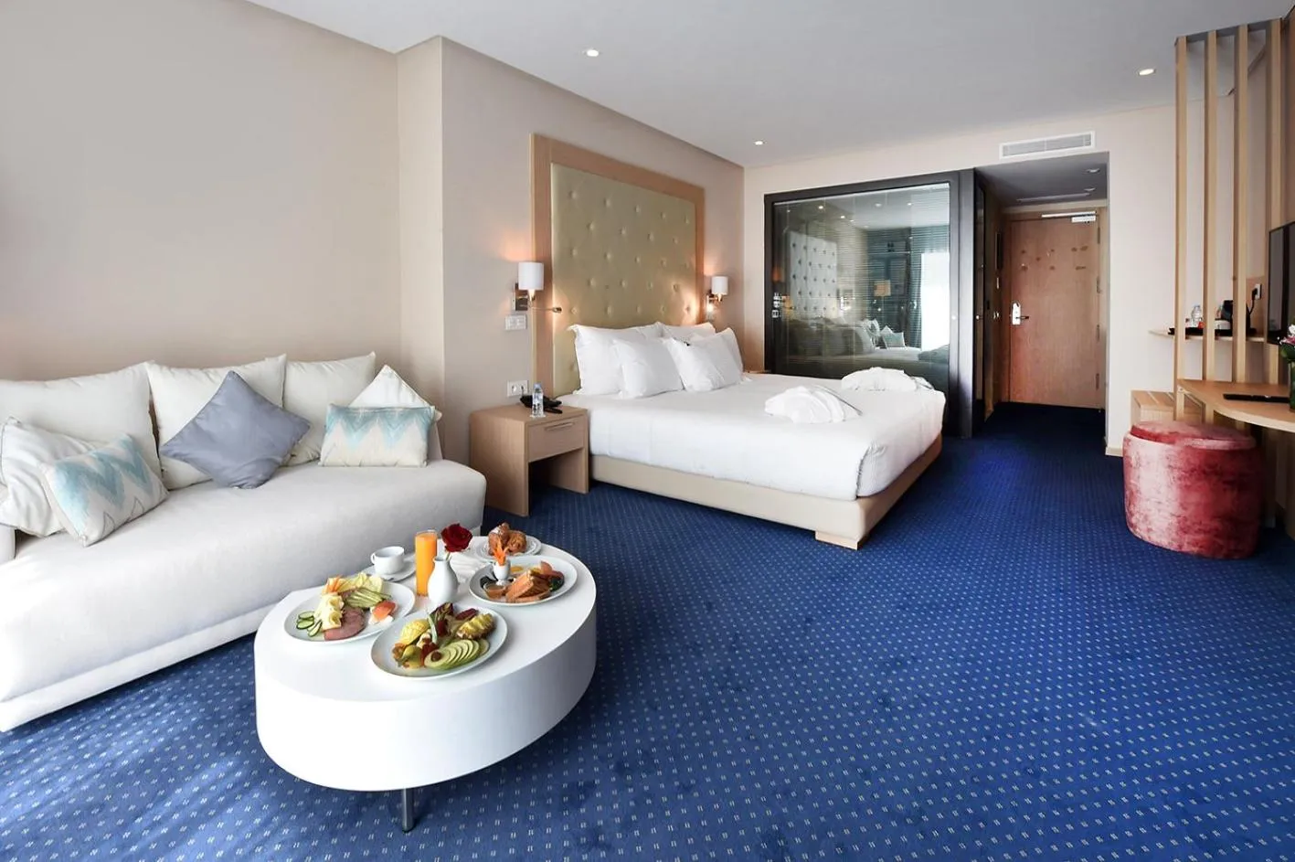 Seating area, Bed in Flower Town Hotel & Spa