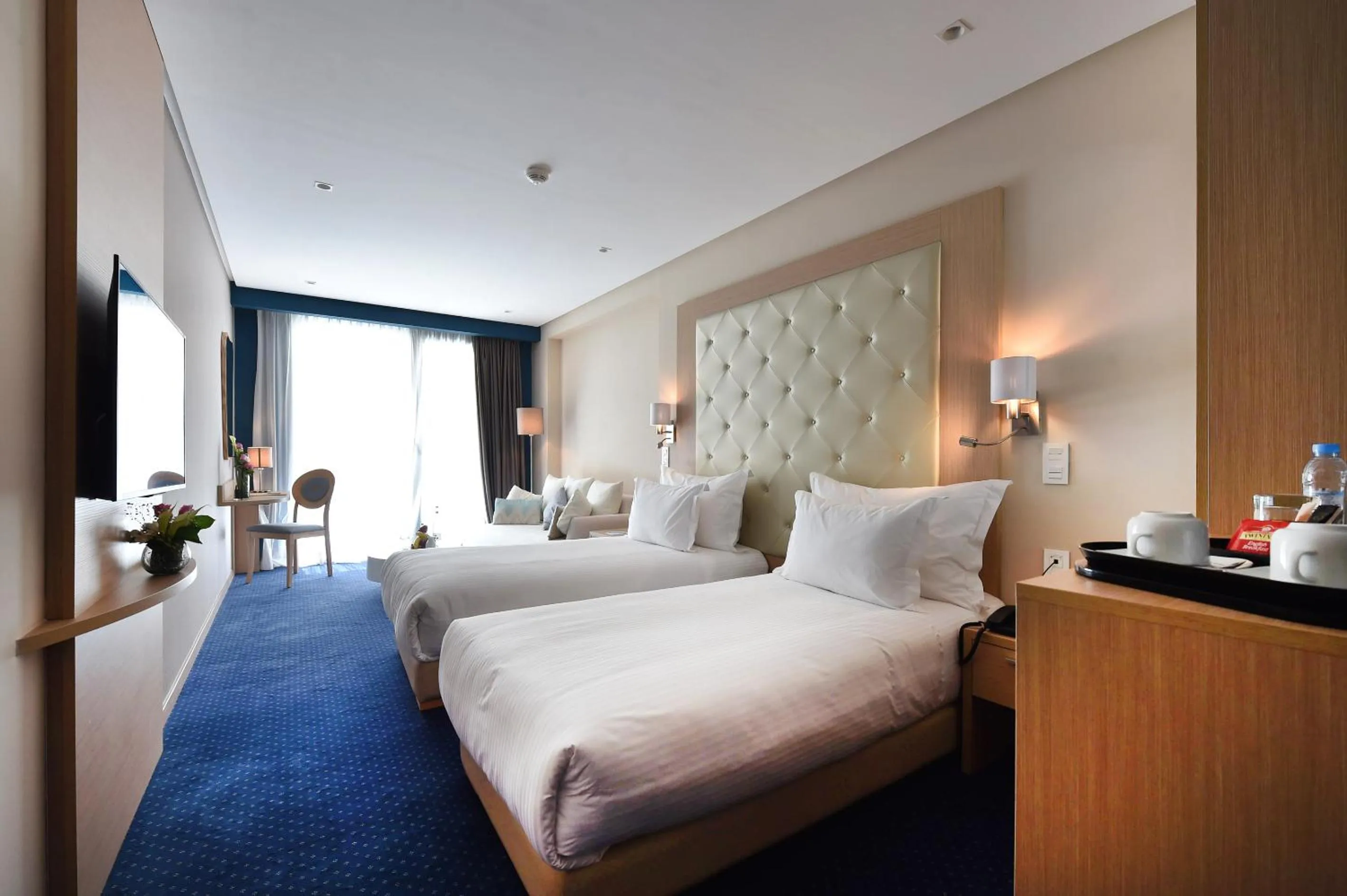 Bed in Flower Town Hotel & Spa