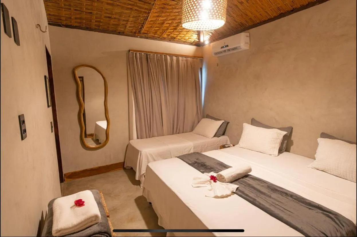 Bed in Pousada Rota dos Ventos