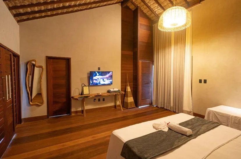 Bed in Pousada Rota dos Ventos