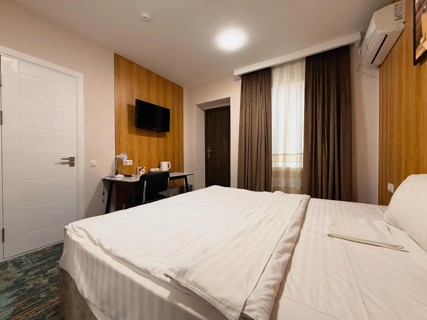 Bed in Musafir Hotel