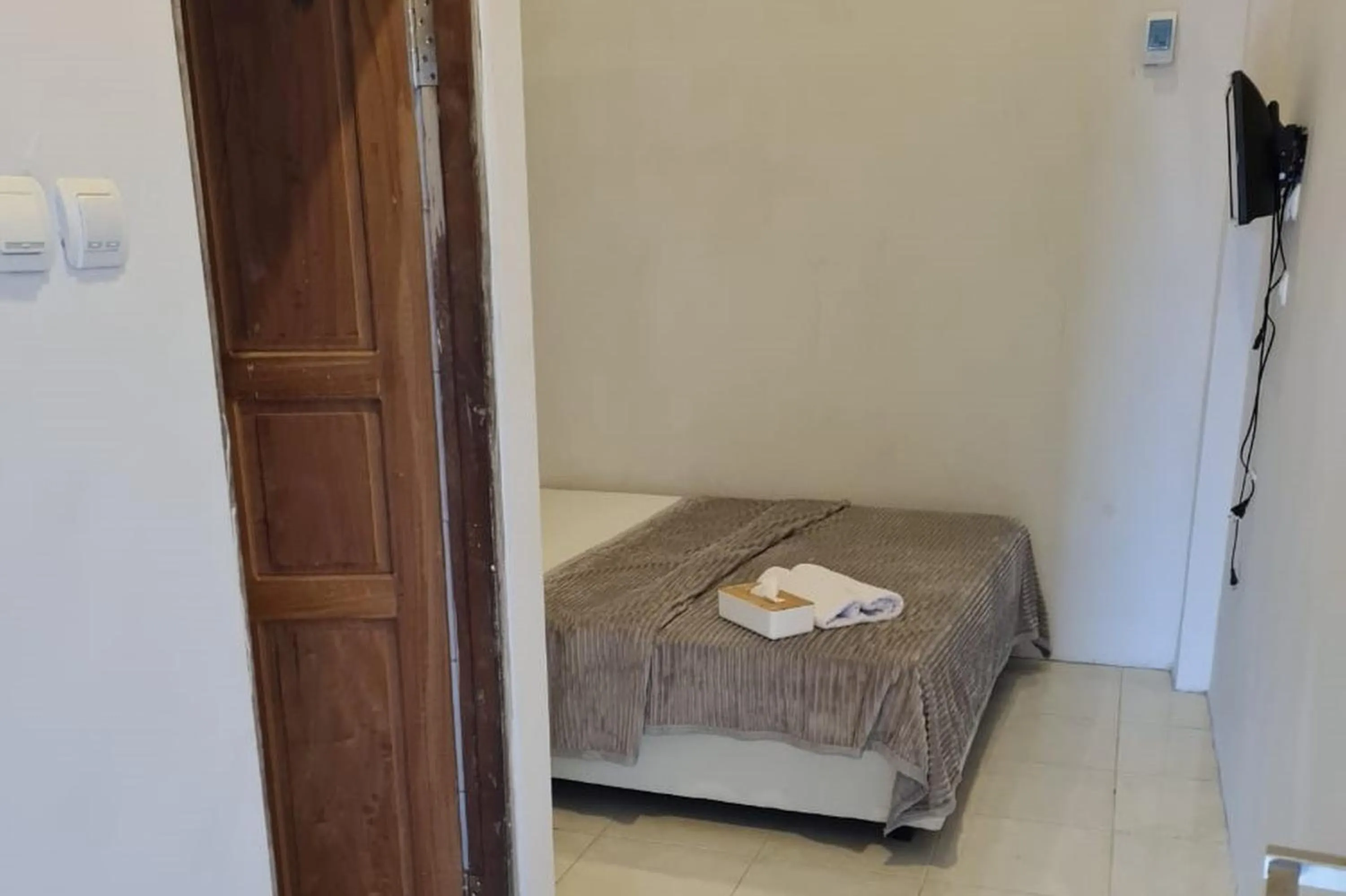 Bed in Krisan Guest House Syariah Banjarbaru Mitra RedDoorz