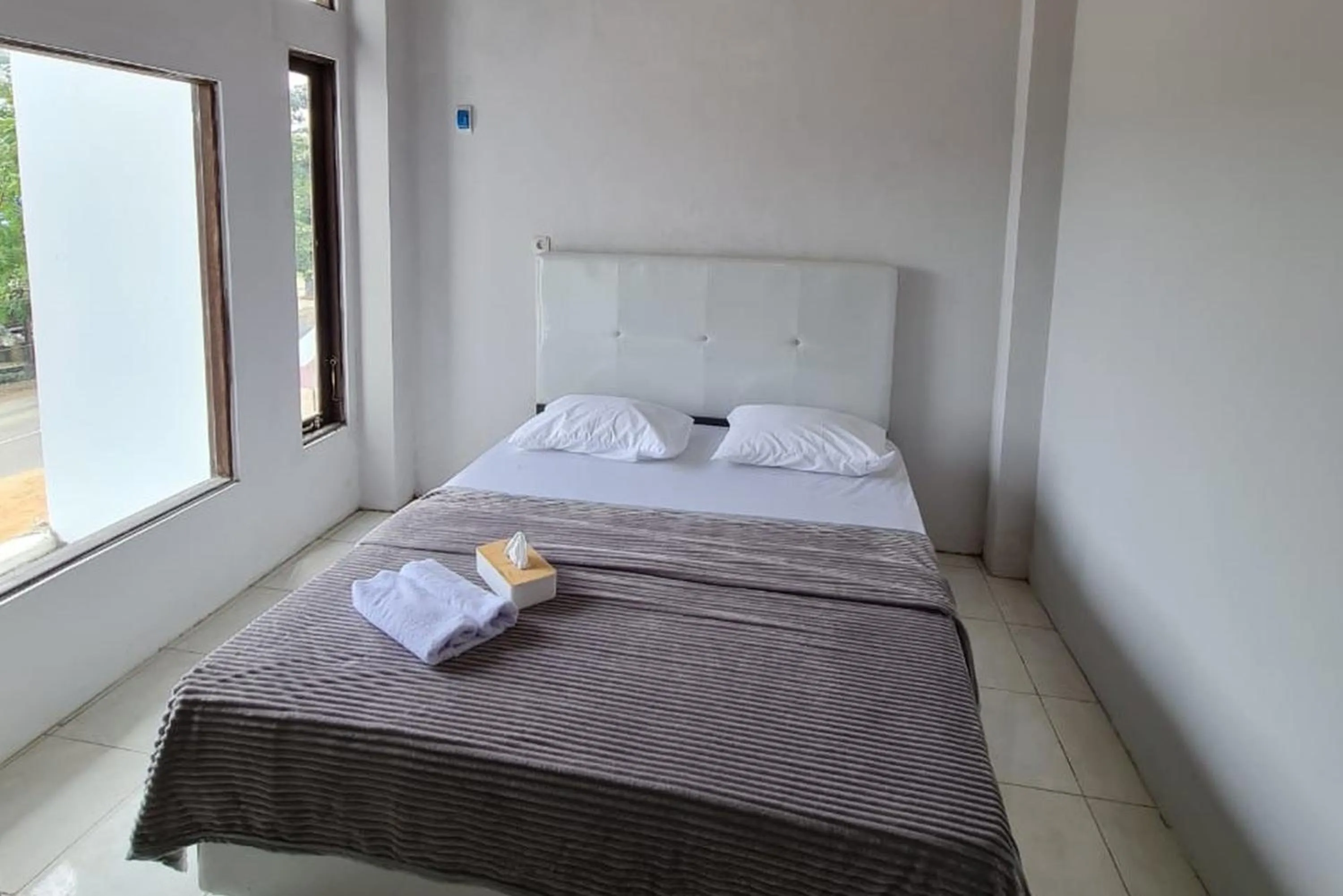 Bed in Krisan Guest House Syariah Banjarbaru Mitra RedDoorz