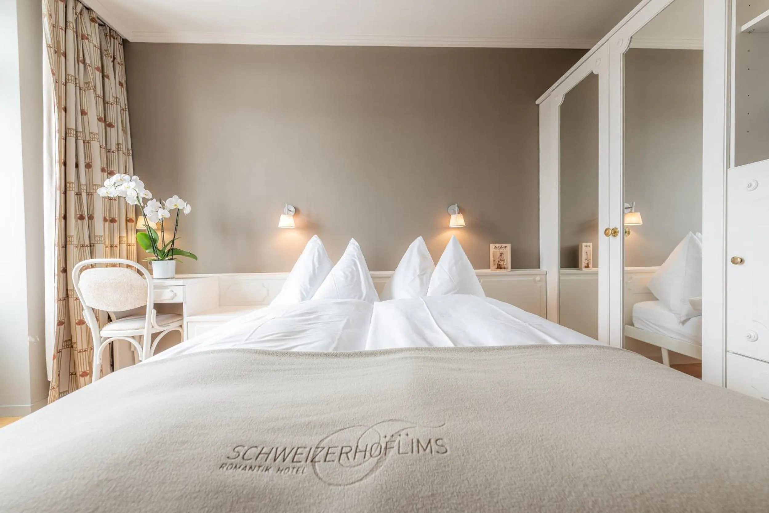 Photo of the whole room, Bed in Romantik Hotel Schweizerhof & Spa Flims