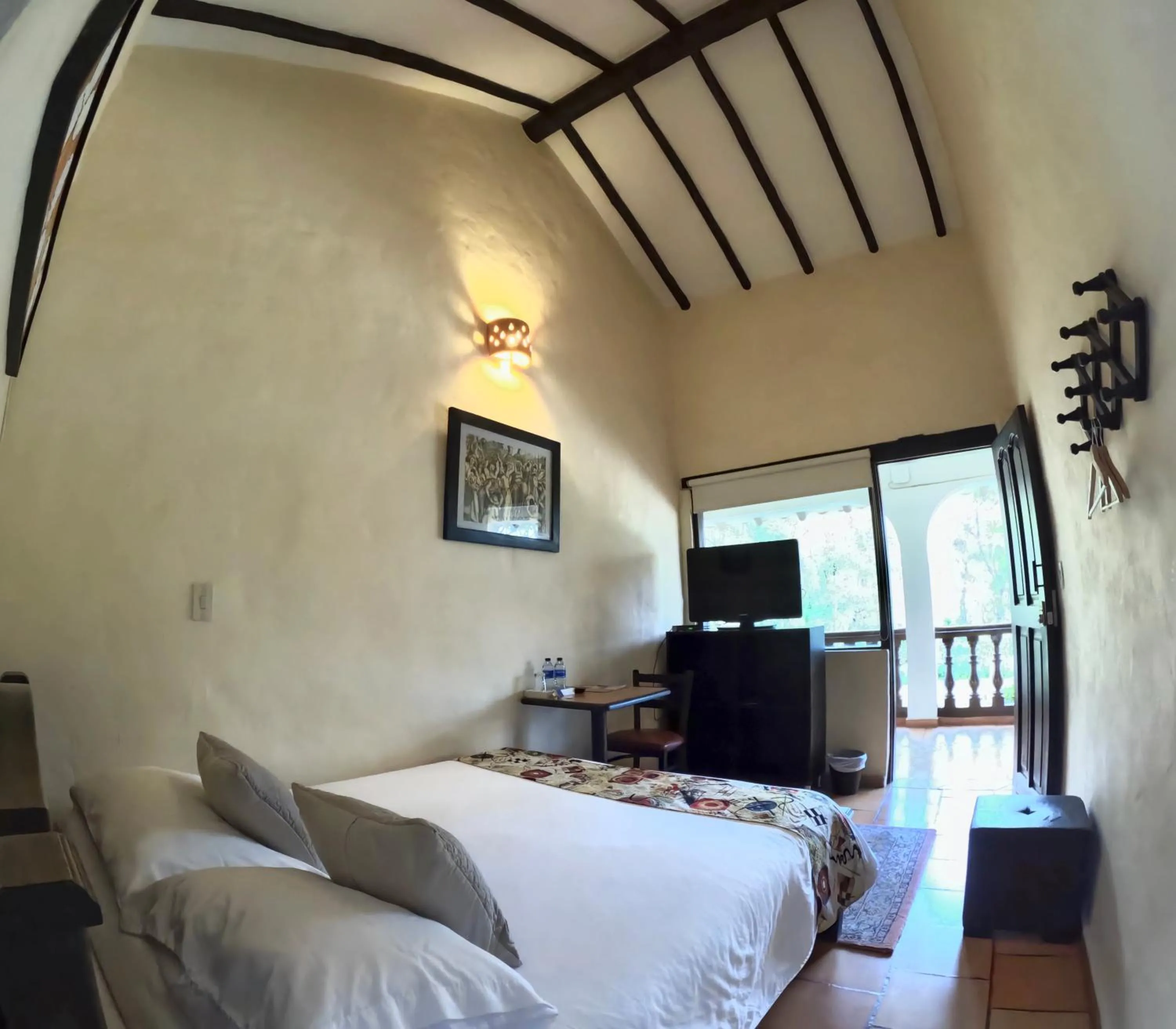 View (from property/room), Bed in Bombon Hotel