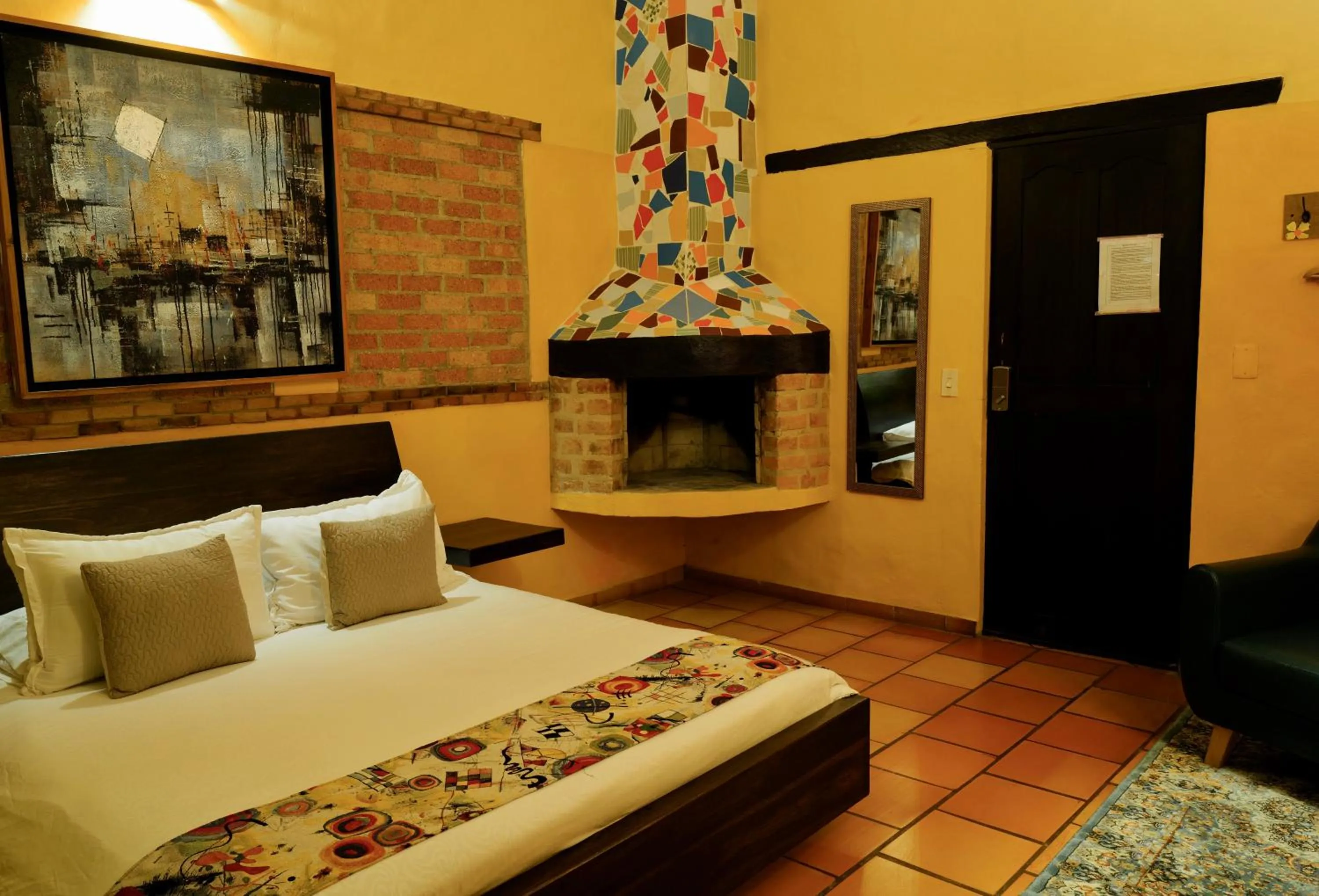 fireplace, Bed in Bombon Hotel