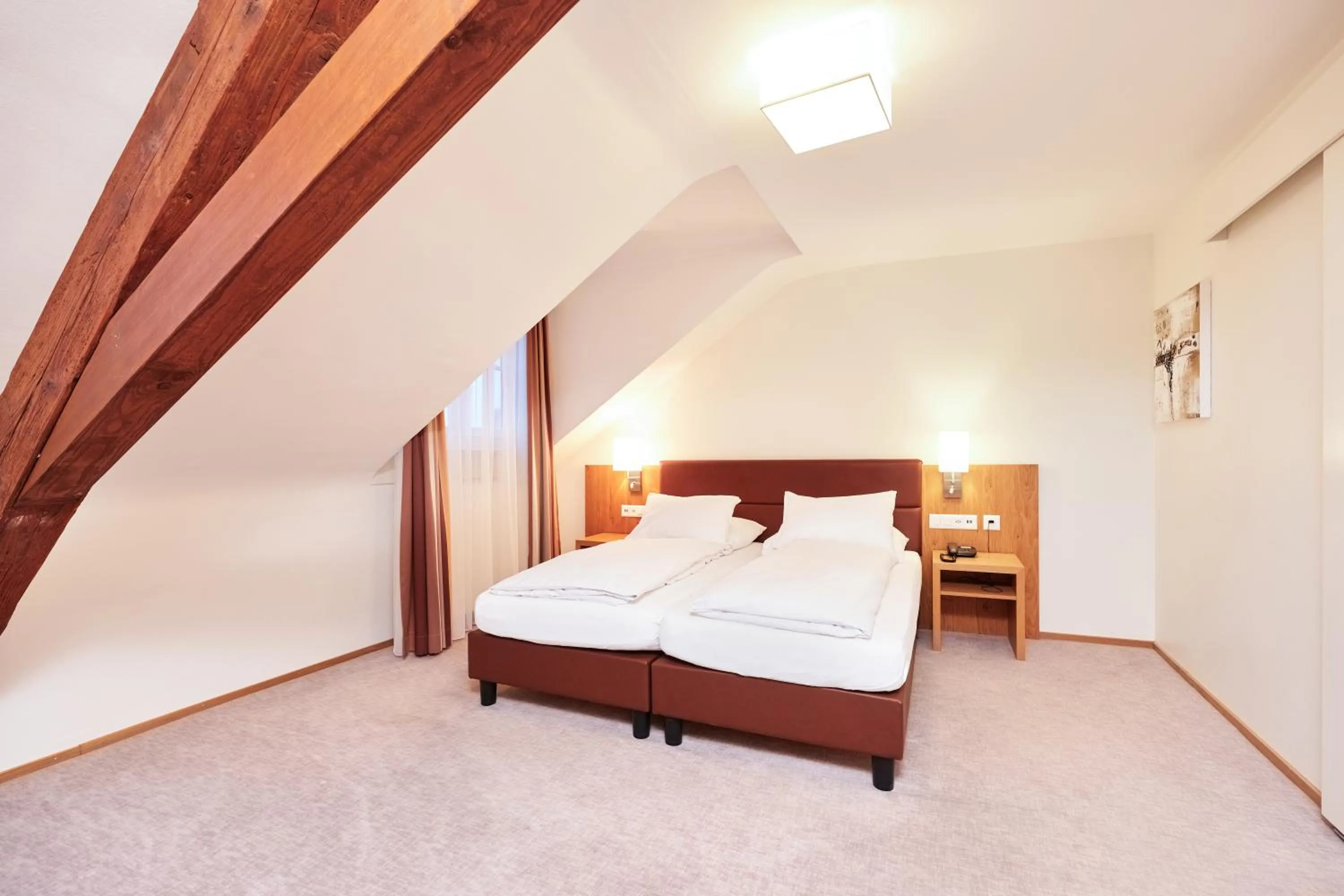 Bed in Central City Hotel Rochat