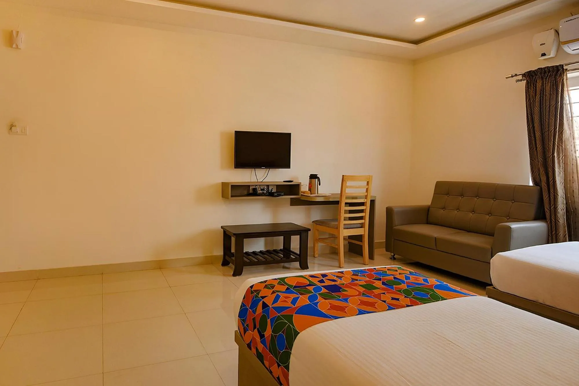 Living room, Bed in FabHotel Champion Gateway - Yelahanka