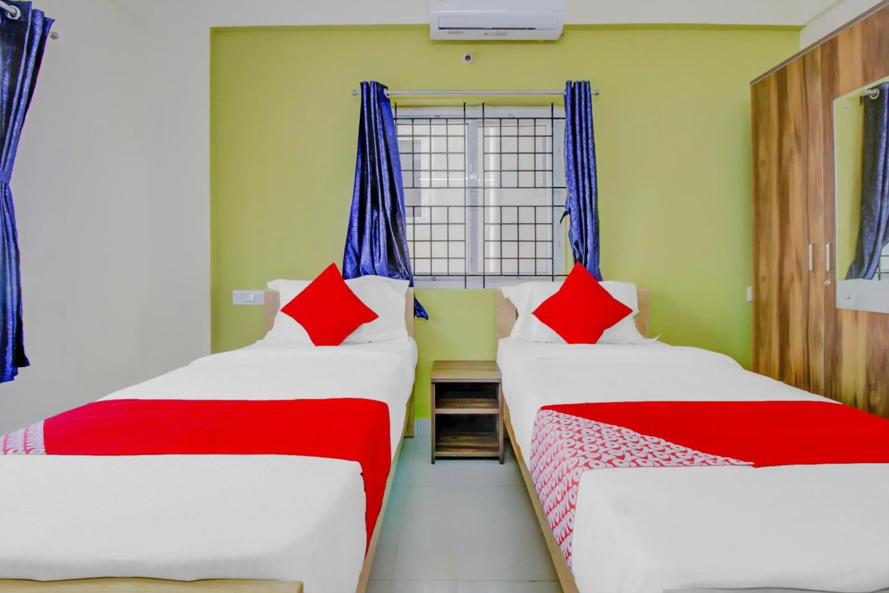 Bedroom in Hotel O Nelli Suites Bedroom in Hotel O Nelli Suites