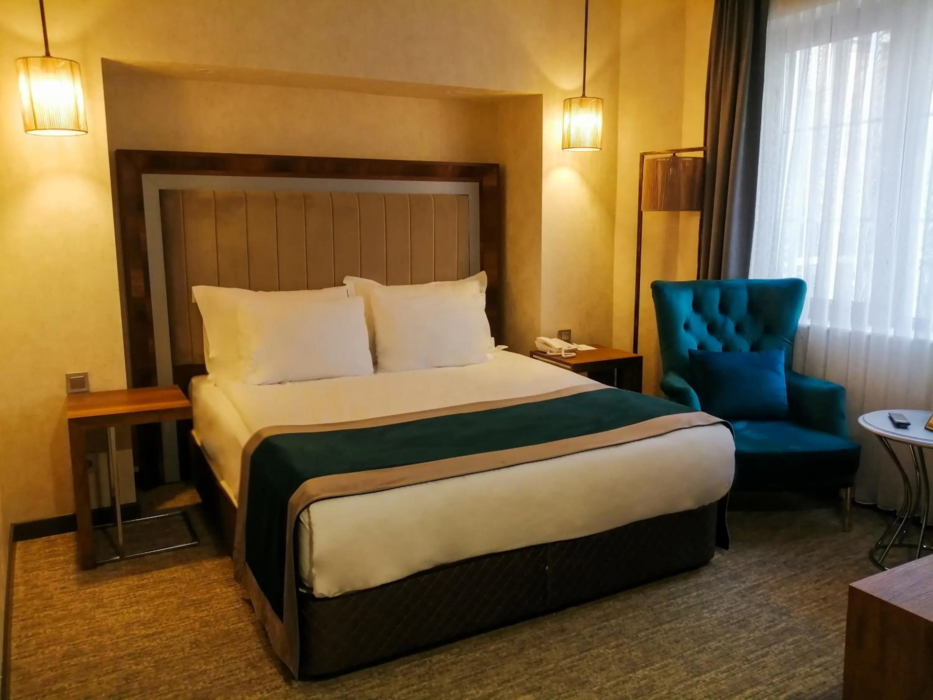 Bed in The Life Hotel & Spa