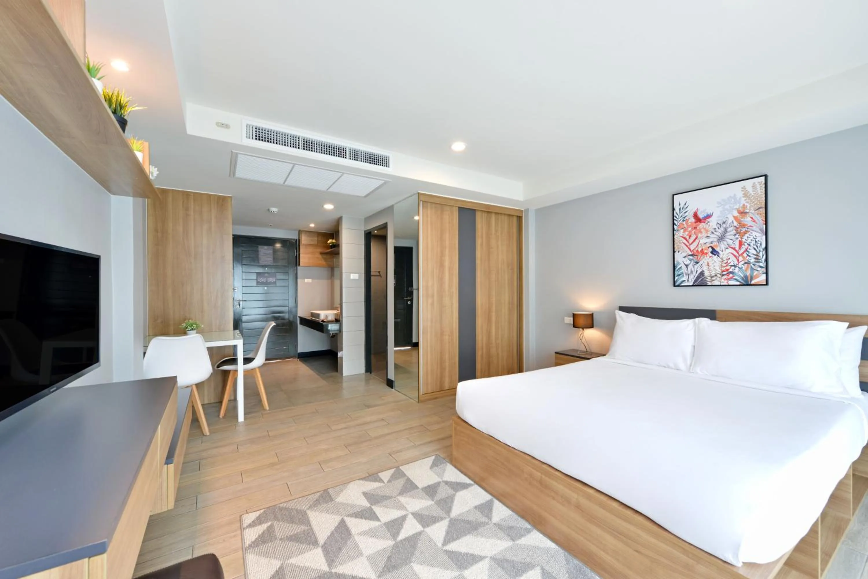 Bed in Raweewan Residence hotel