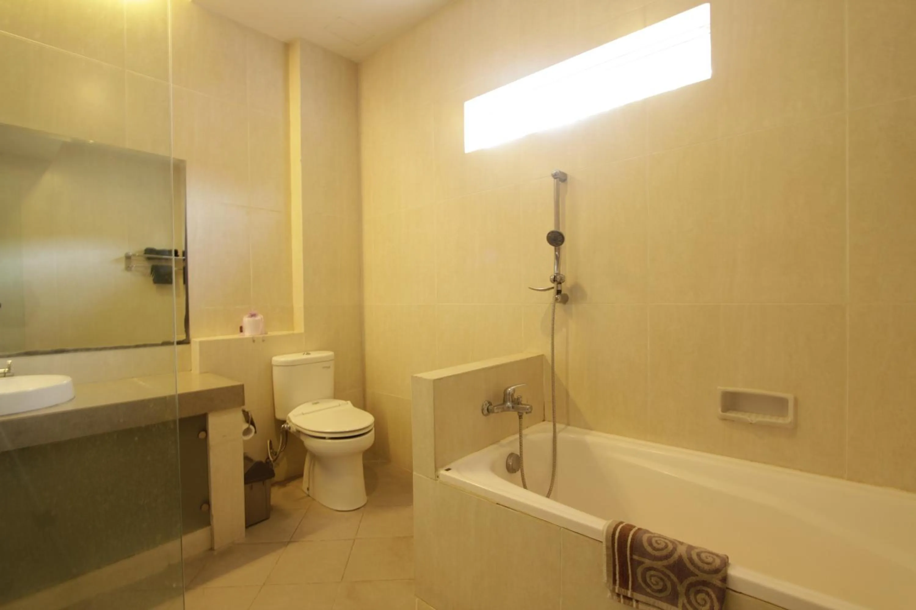 Bathroom in Alit Beach Resort and Villas