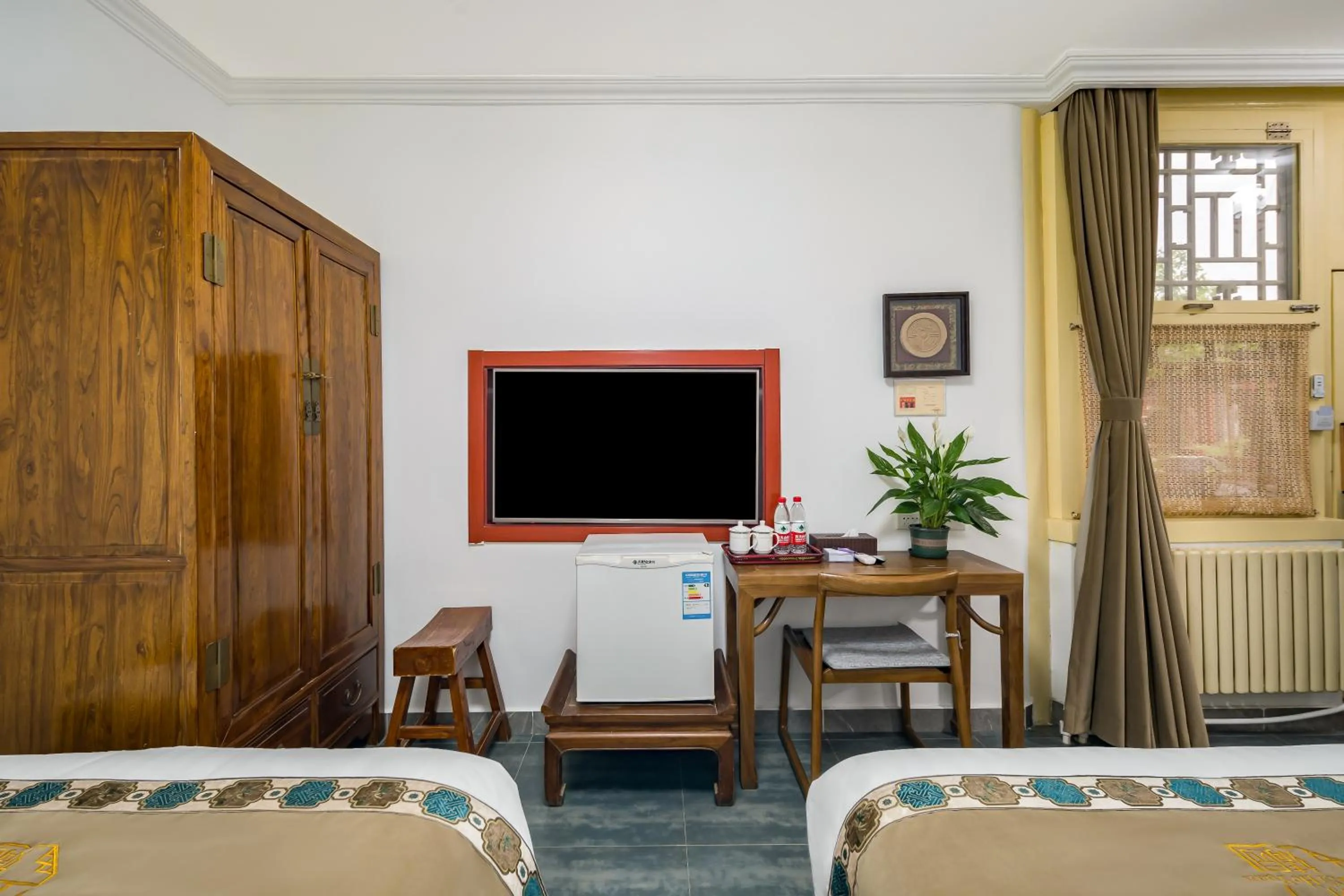 Bed in Beijing Jingyuan Courtyard Hotel