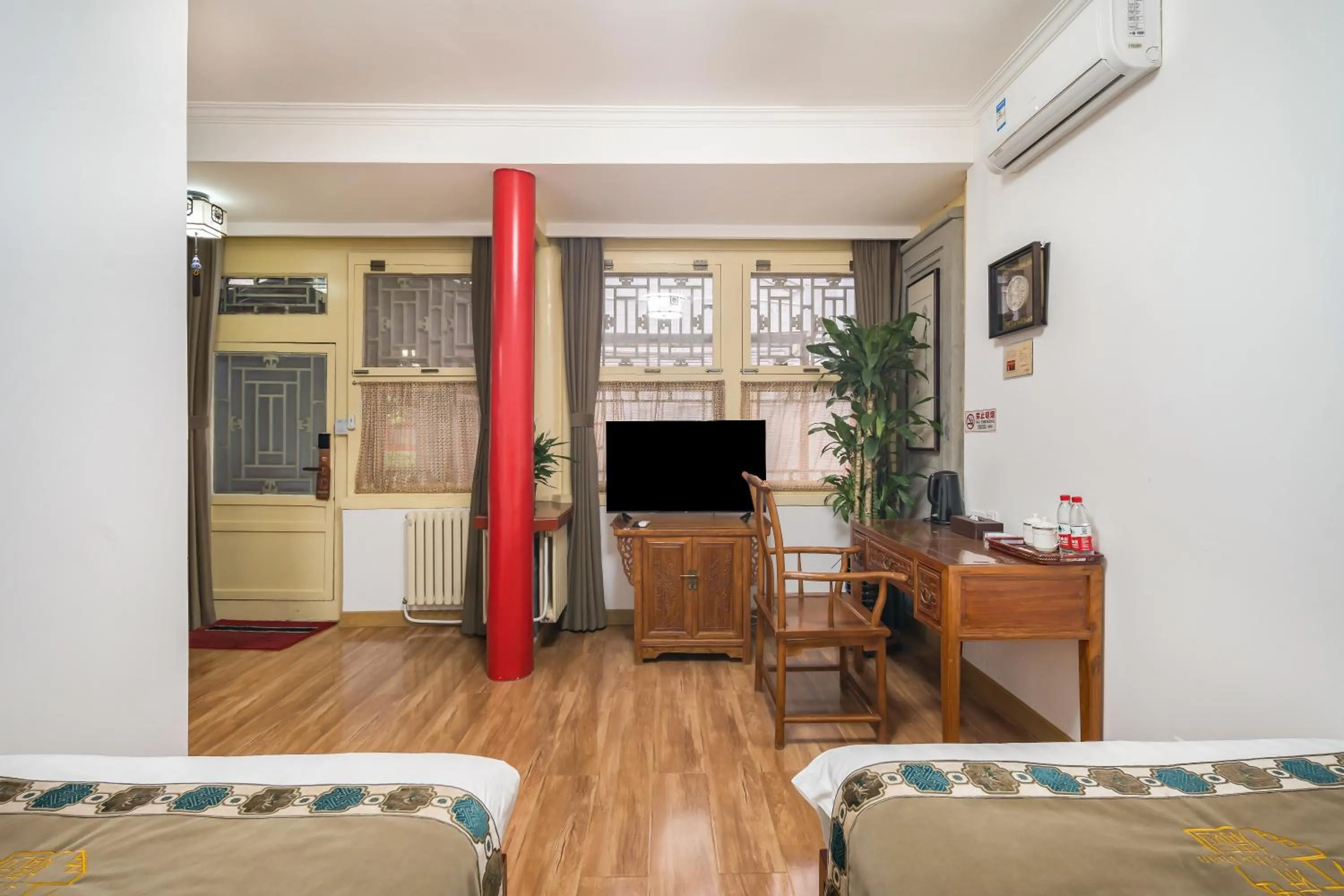 Bed in Beijing Jingyuan Courtyard Hotel