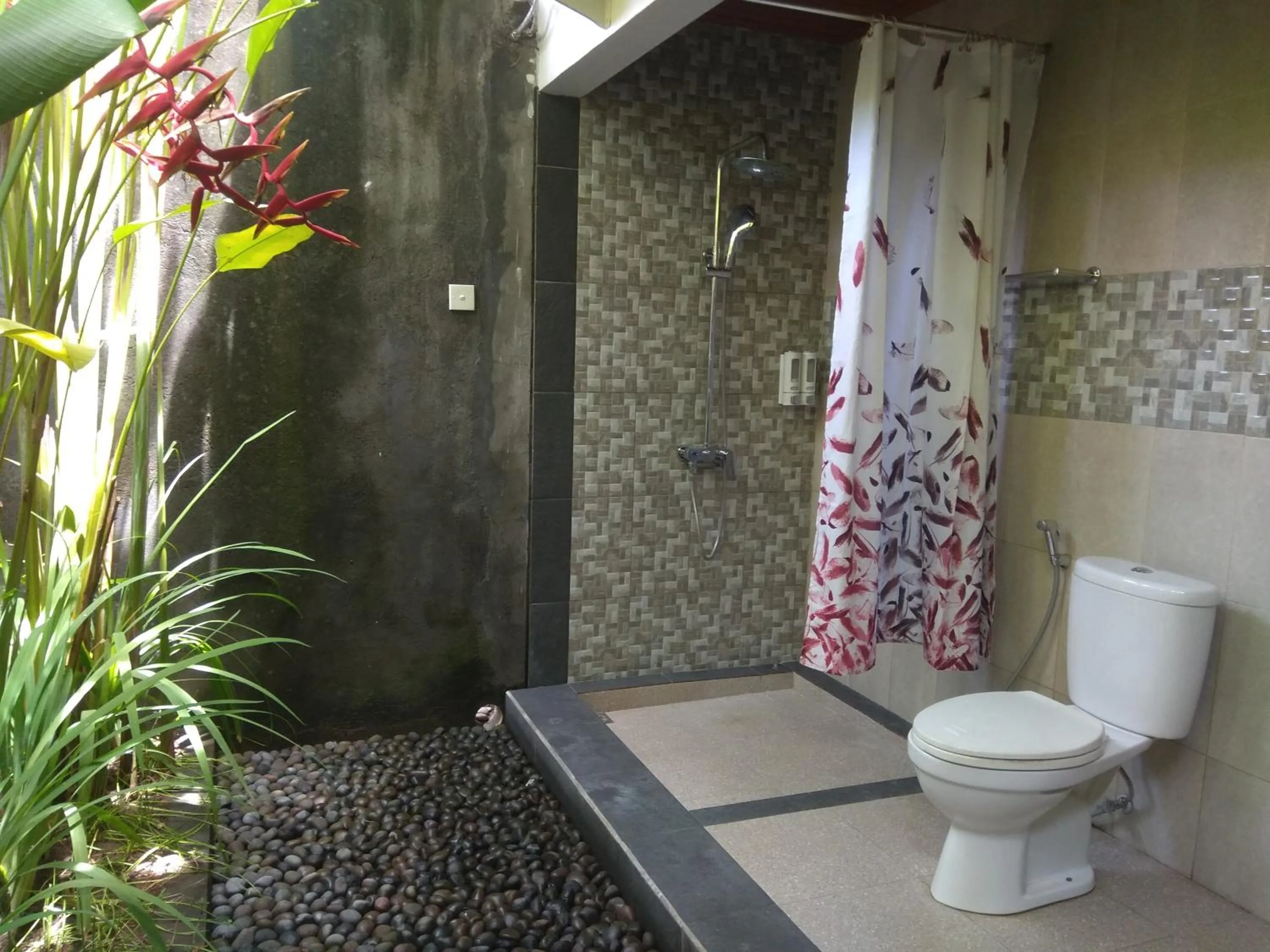 Bathroom in Tamiu Guesthouse at Desa Wisata Keramas Near Keramas Surf Beach