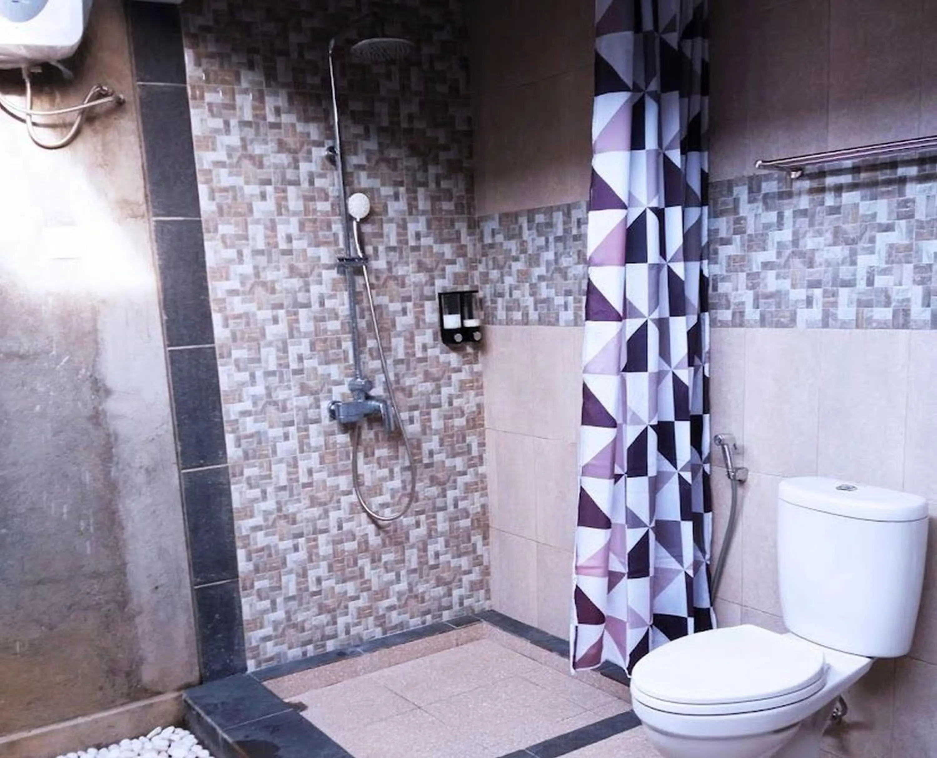 Bathroom in Tamiu Guesthouse at Desa Wisata Keramas Near Keramas Surf Beach