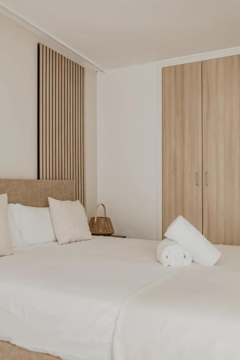 Bed in Portomar Apartments - 4-Star Superior Hotel